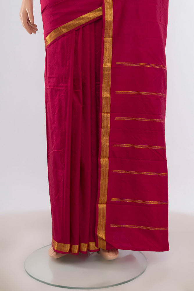 Pleats and pallu of Maroon Kanchipuram Silk Saree with Zari Butta on the body and Silk Border. 