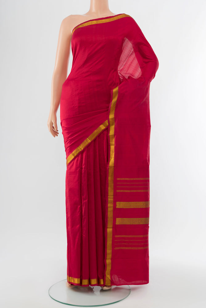 Maroon Kanchipuram Silk Saree with Plain Body and Silk Border.  displayed on a mannequin