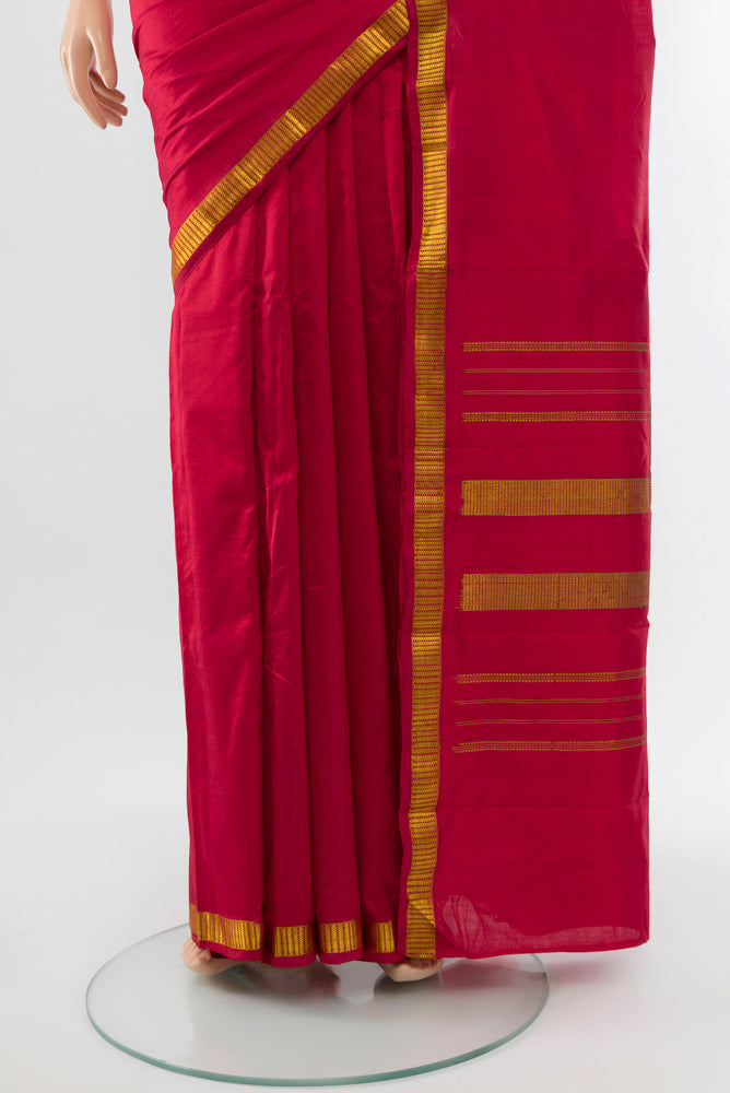 Pleats and pallu of Maroon Kanchipuram Silk Saree with Plain Body and Silk Border. 