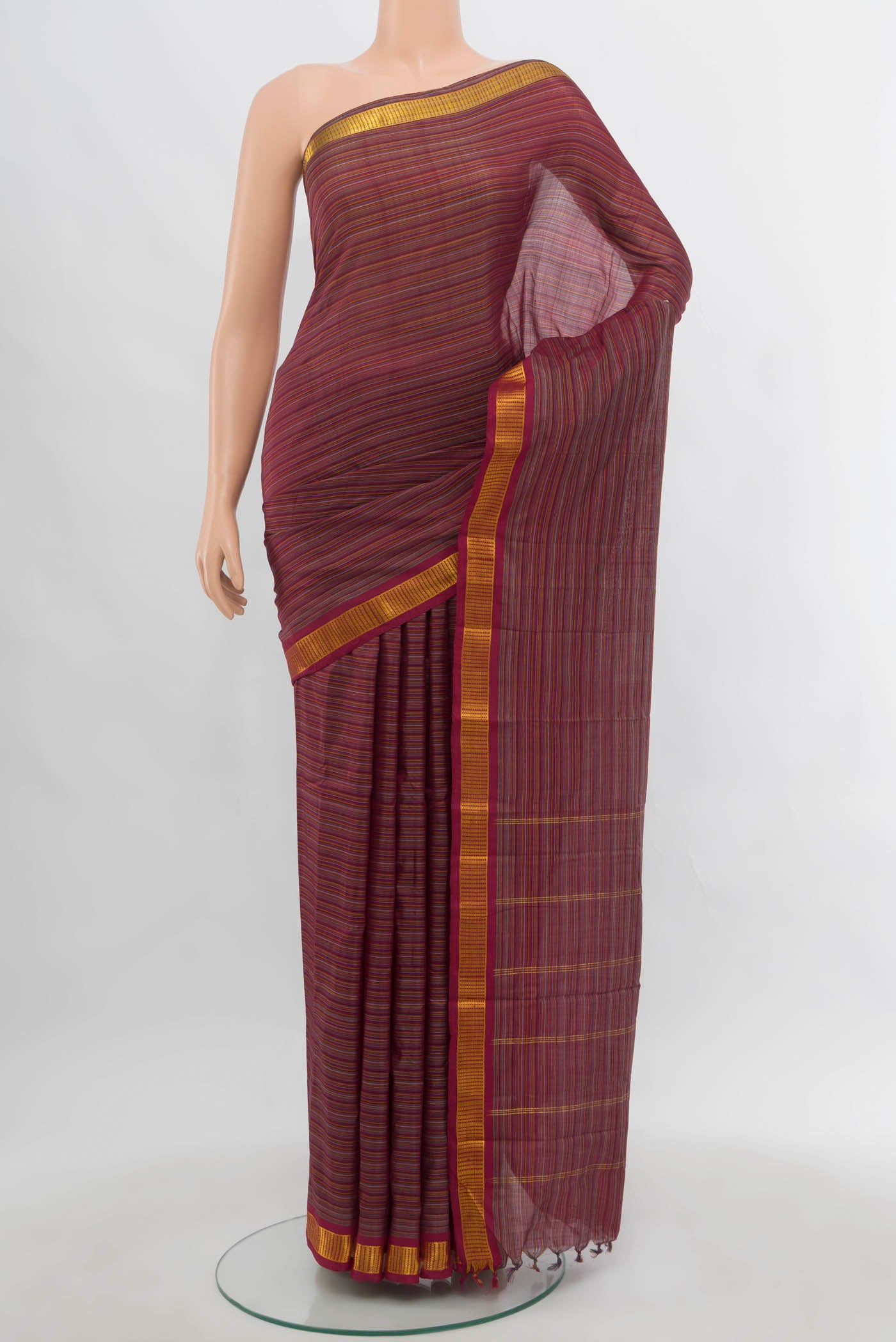 Multi Color Kanjivaram Silk Saree with Zari Butta on the body and Silk Border.  displayed on a mannequin