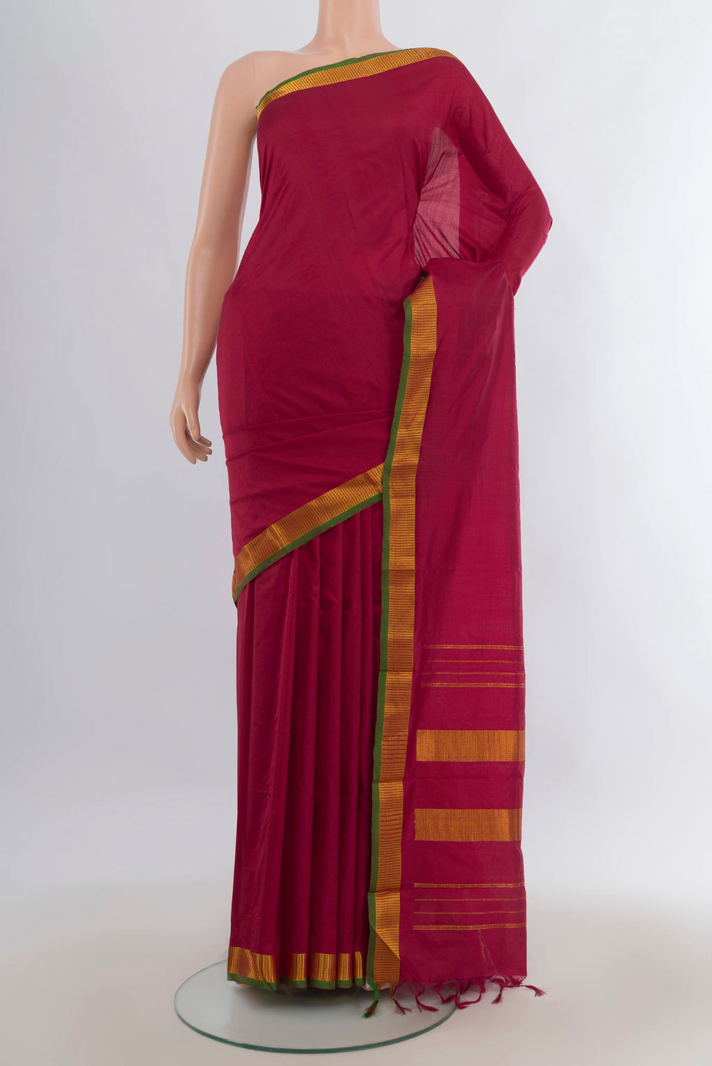 Pure Silk Maroon Kanjivaram Saree with Plain Body and Zari Border.  displayed on a mannequin