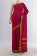 Pure Silk Maroon Kanjivaram Saree with Plain Body and Zari Border.  displayed on a mannequin