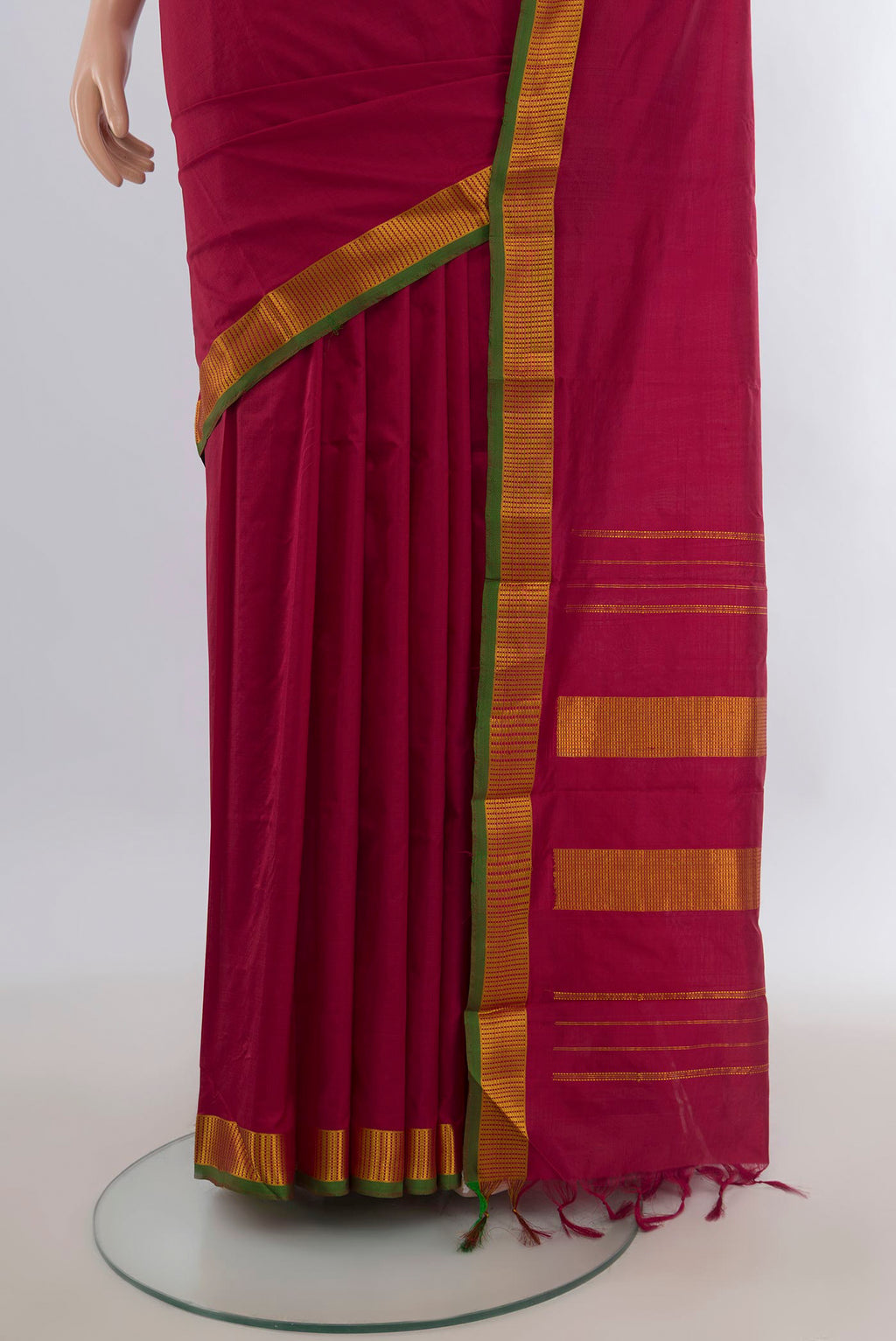 Pleats and pallu of Pure Silk Maroon Kanjivaram Saree with Plain Body and Zari Border. 
