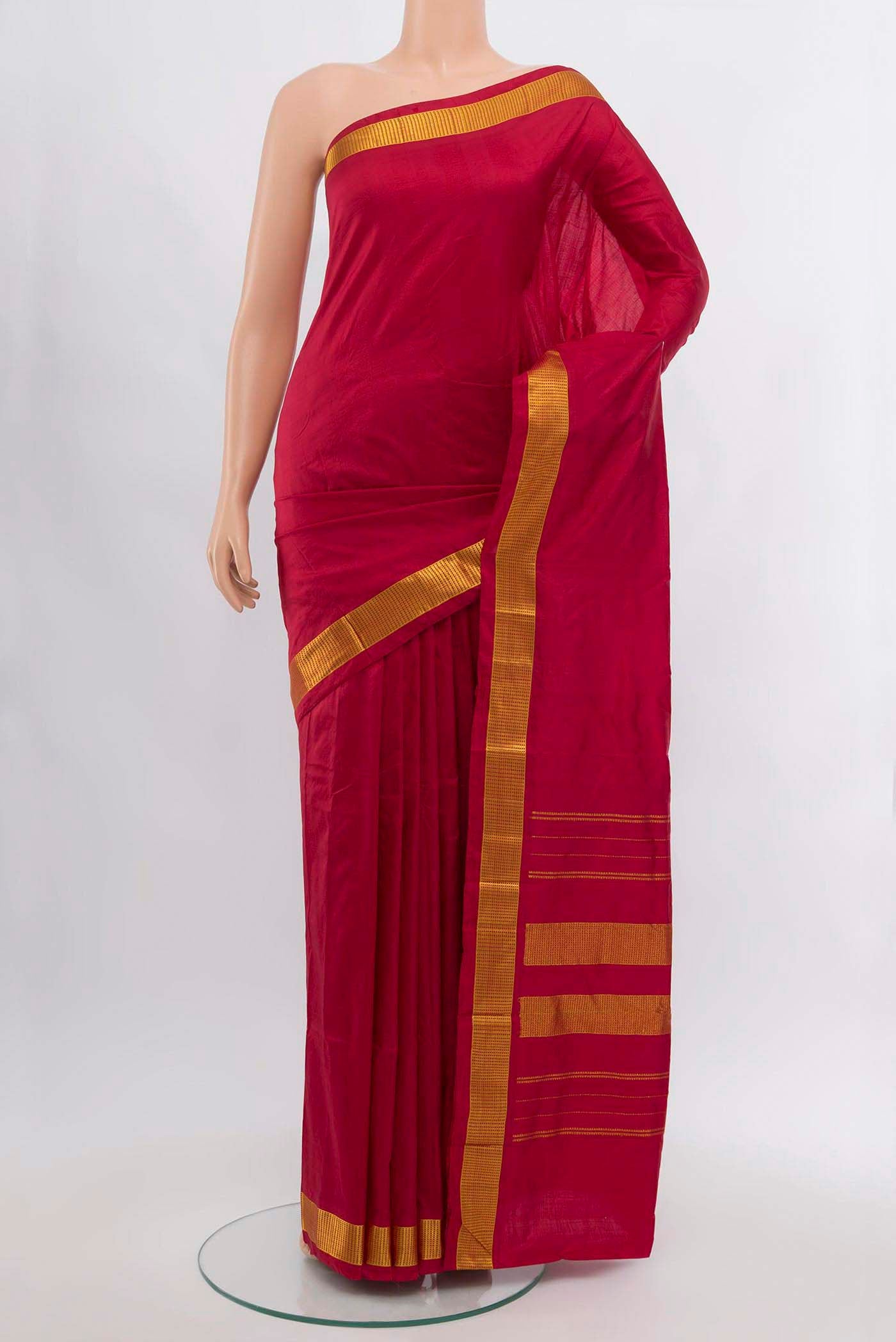 Maroon Kanjivaram Silk Saree with Plain Body and Silk Border.  displayed on a mannequin