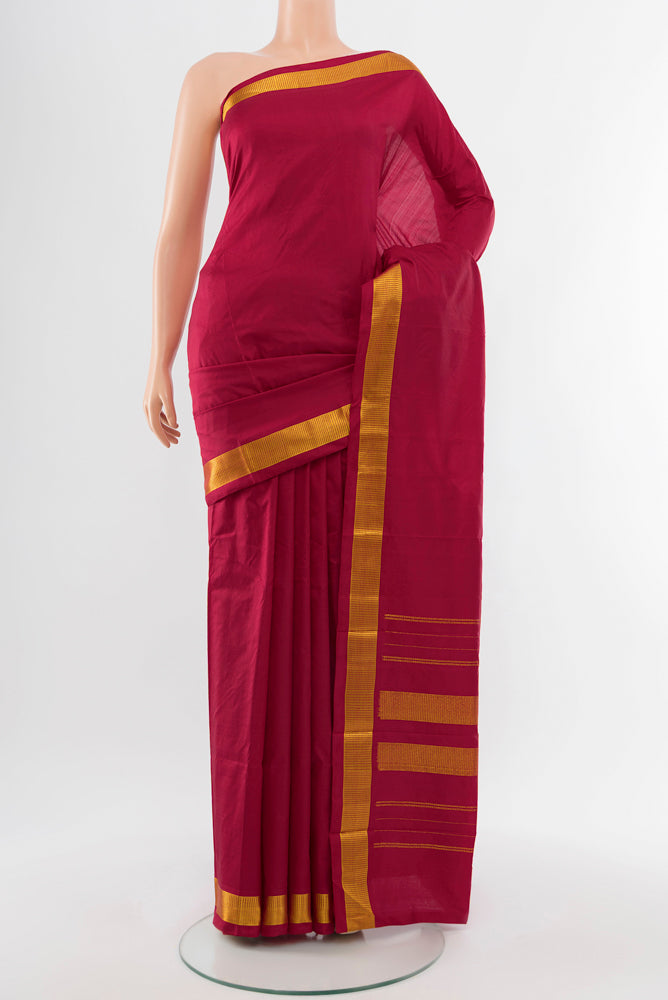 Maroon Kanjivaram Silk Saree with Plain Body and Silk Border.  displayed on a mannequin