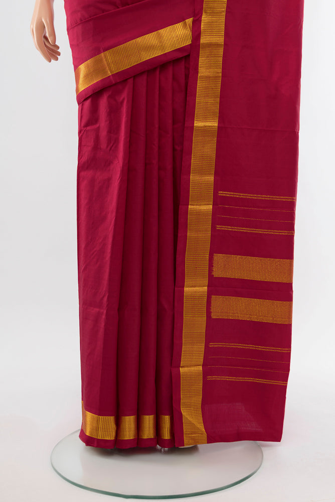 Pleats and pallu of Maroon Kanjivaram Silk Saree with Plain Body and Silk Border. 