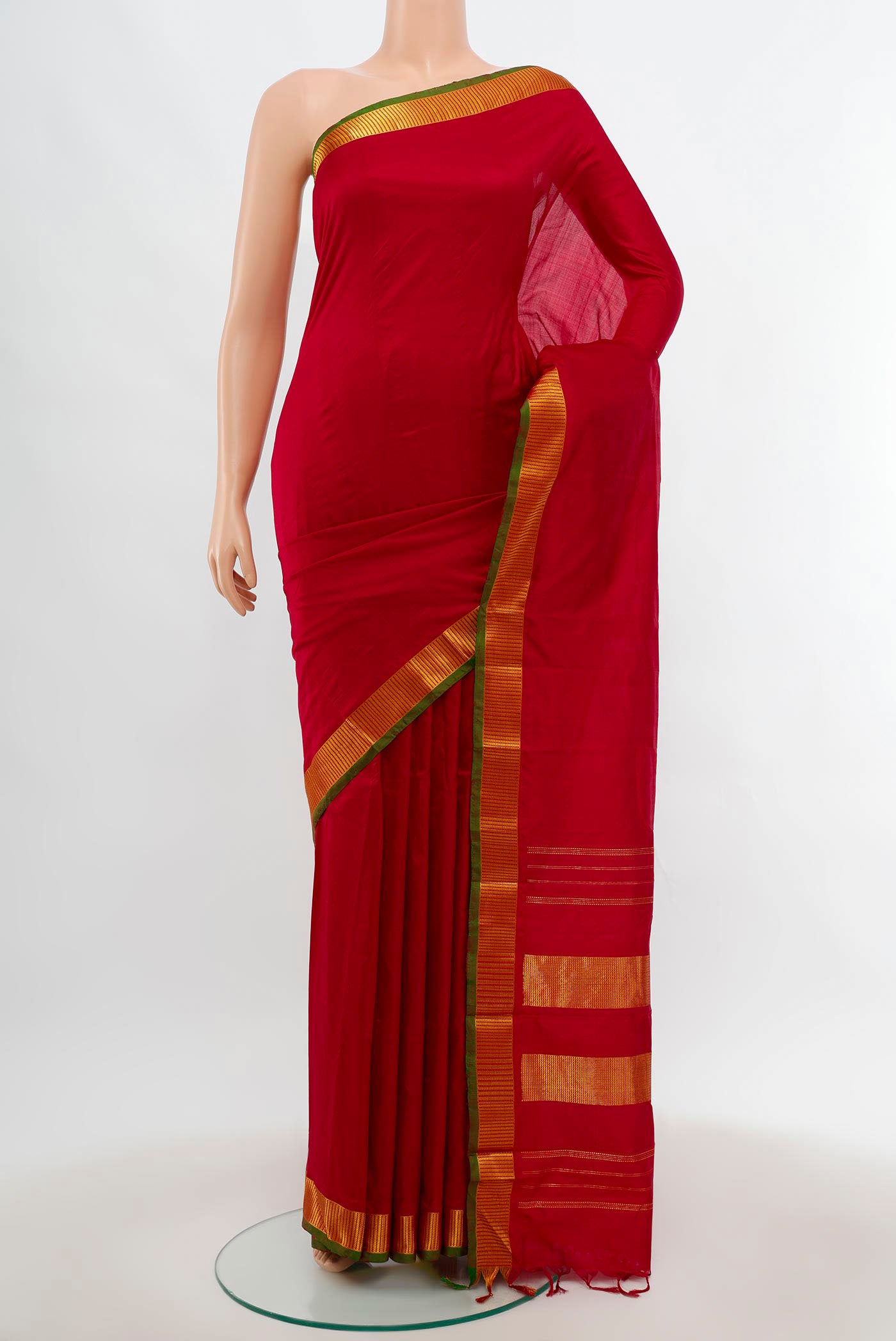 Maroon Kanjivaram Silk Saree with Plain Body and Silk Border.  displayed on a mannequin