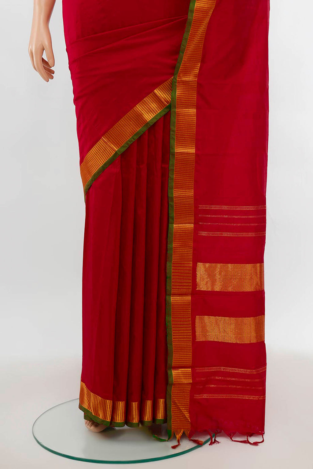 Pleats and pallu of Maroon Kanjivaram Silk Saree with Plain Body and Silk Border. 