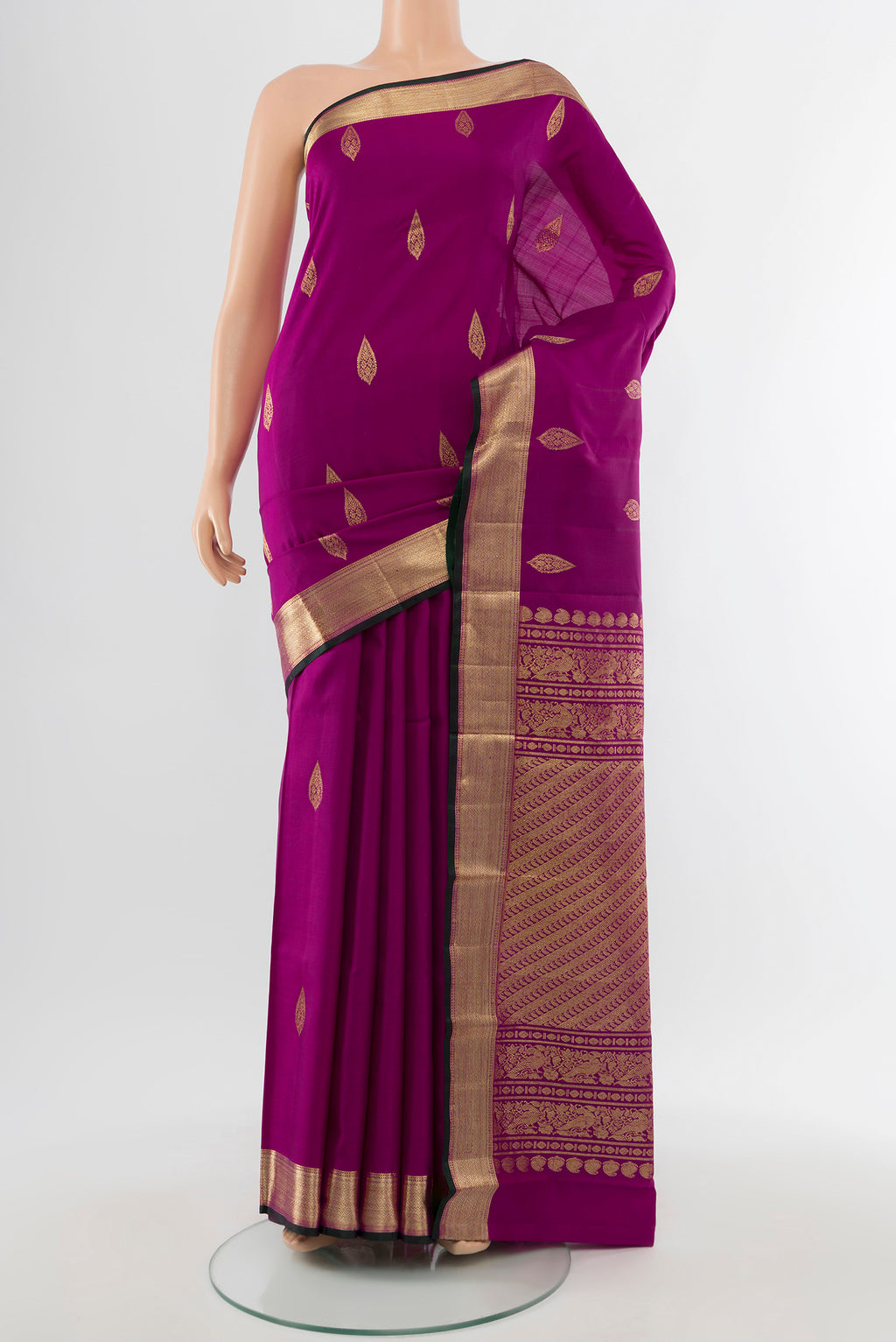 Pure Silk Pure Zari Purple Kanjivaram Saree with Zari Butta on the body and Silk Border.  displayed on a mannequin