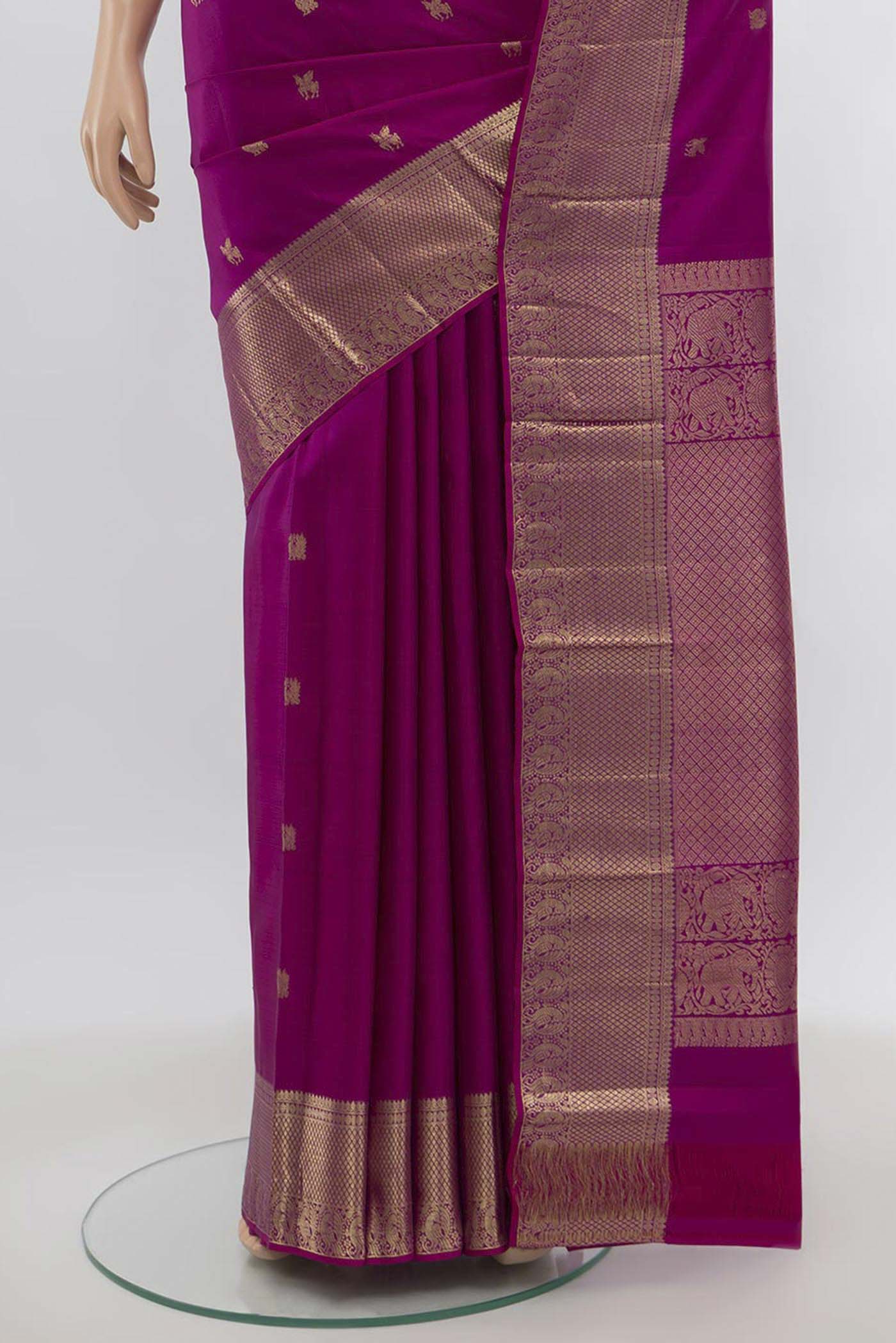 Pleats and pallu of Purple Kanjivaram Silk Saree with Zari Butta on the body and Silk Border. 