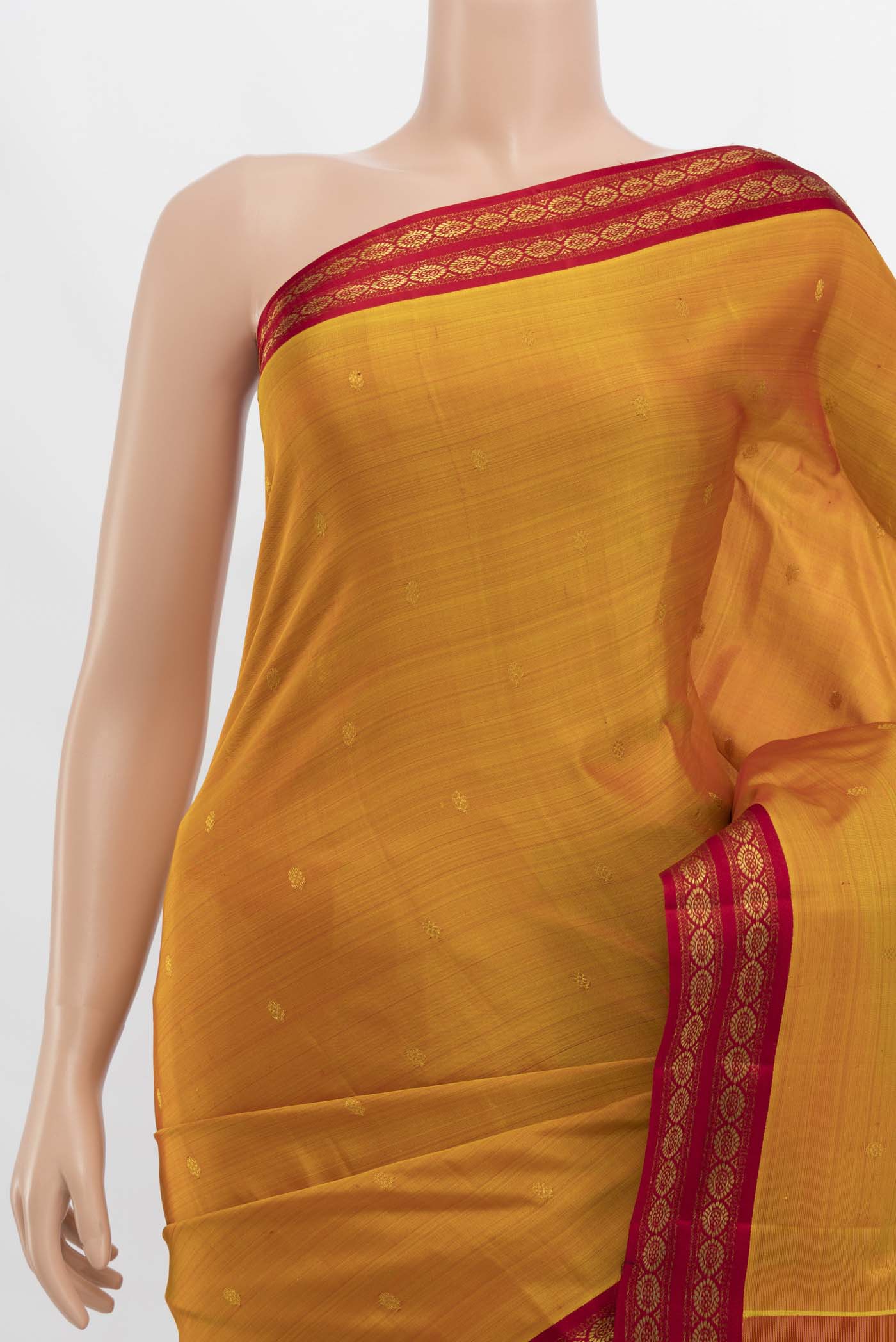 Border image of Mustard Kanchipuram Silk Saree with Zari Butta on the body and Zari Border. 