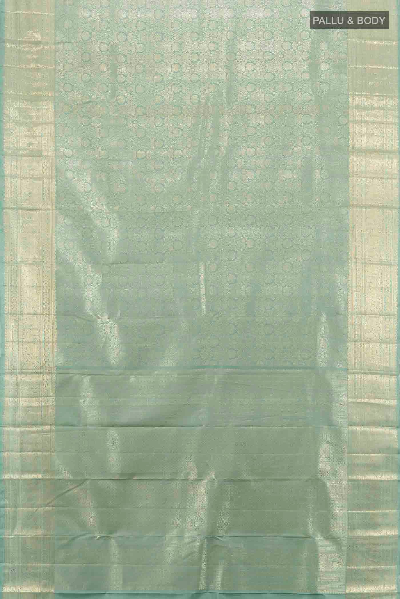 Flat view of Mint Green Kanchipuram Silk Saree with Zari Butta on the body and Silk Border. 