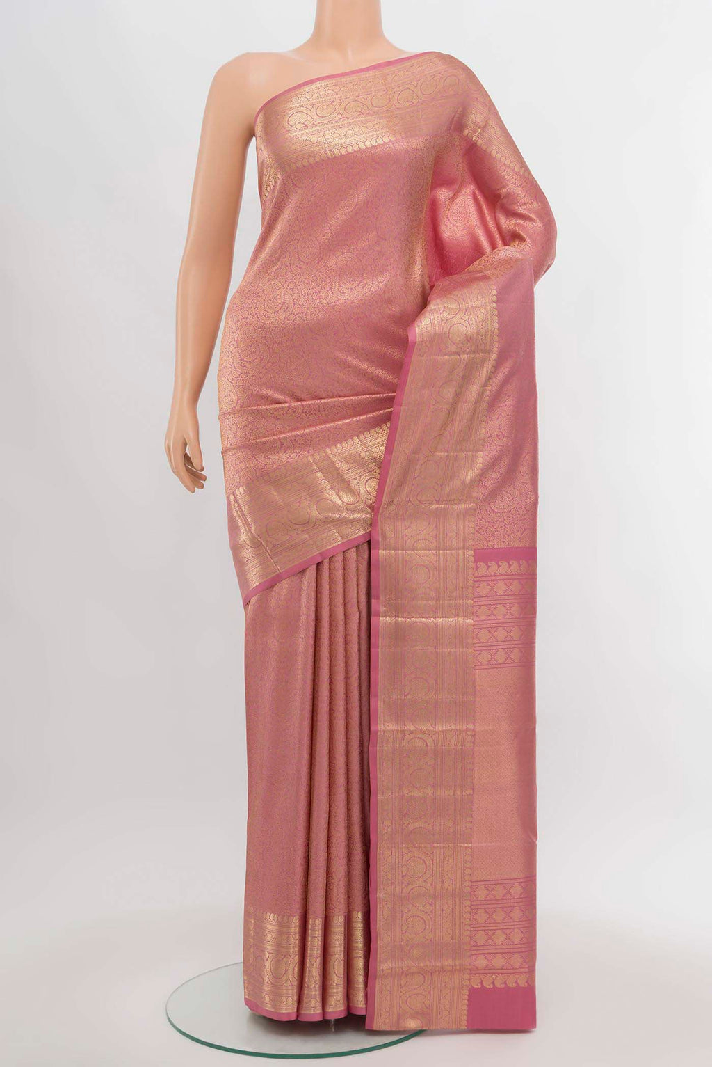 Golden Peach Kanchipuram Silk Saree with Zari Butta on the body and Silk Border.  displayed on a mannequin