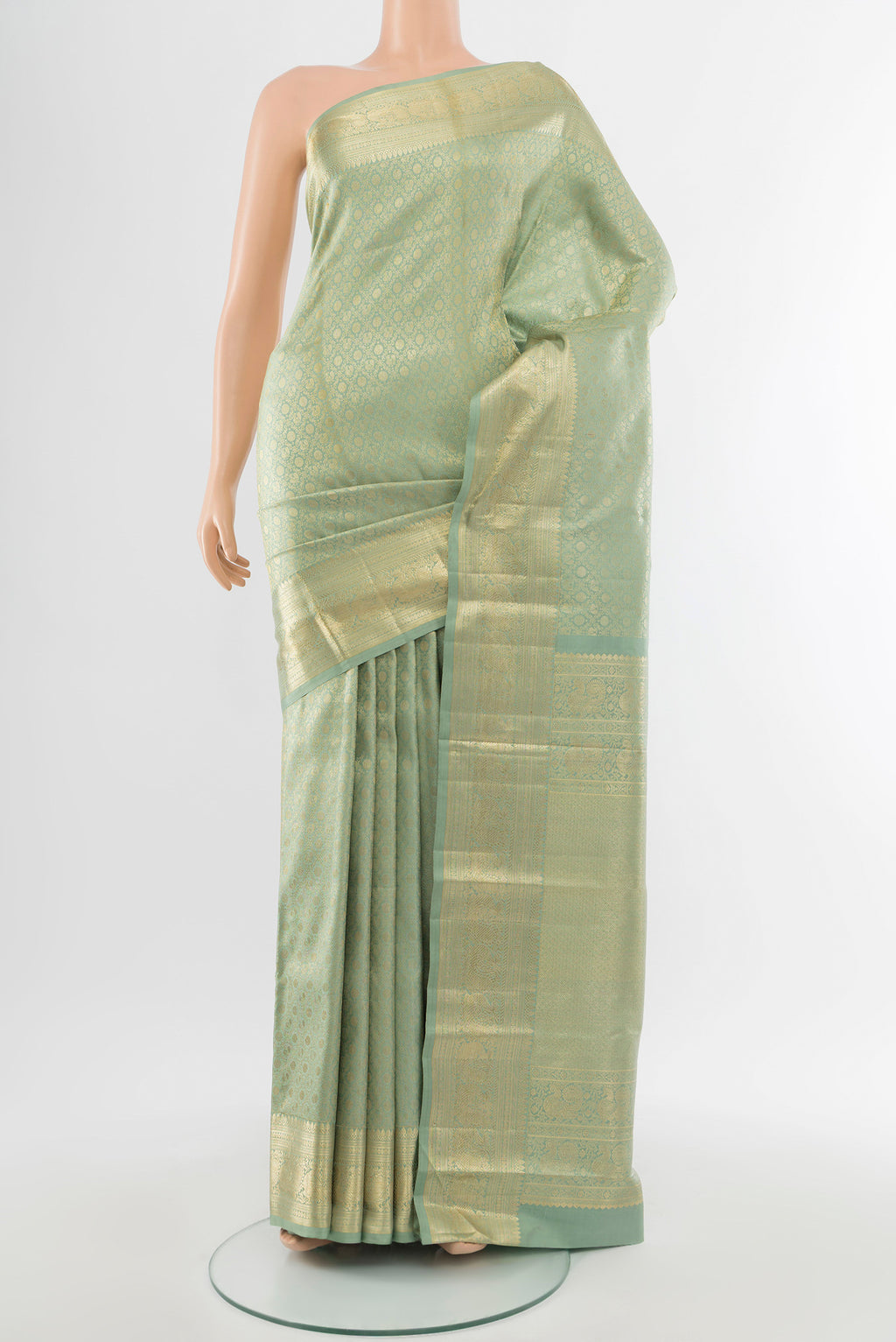 Pure Silk Pure Zari Golden Kanchipuram Saree with Zari Butta on the body and Silk Border.  displayed on a mannequin