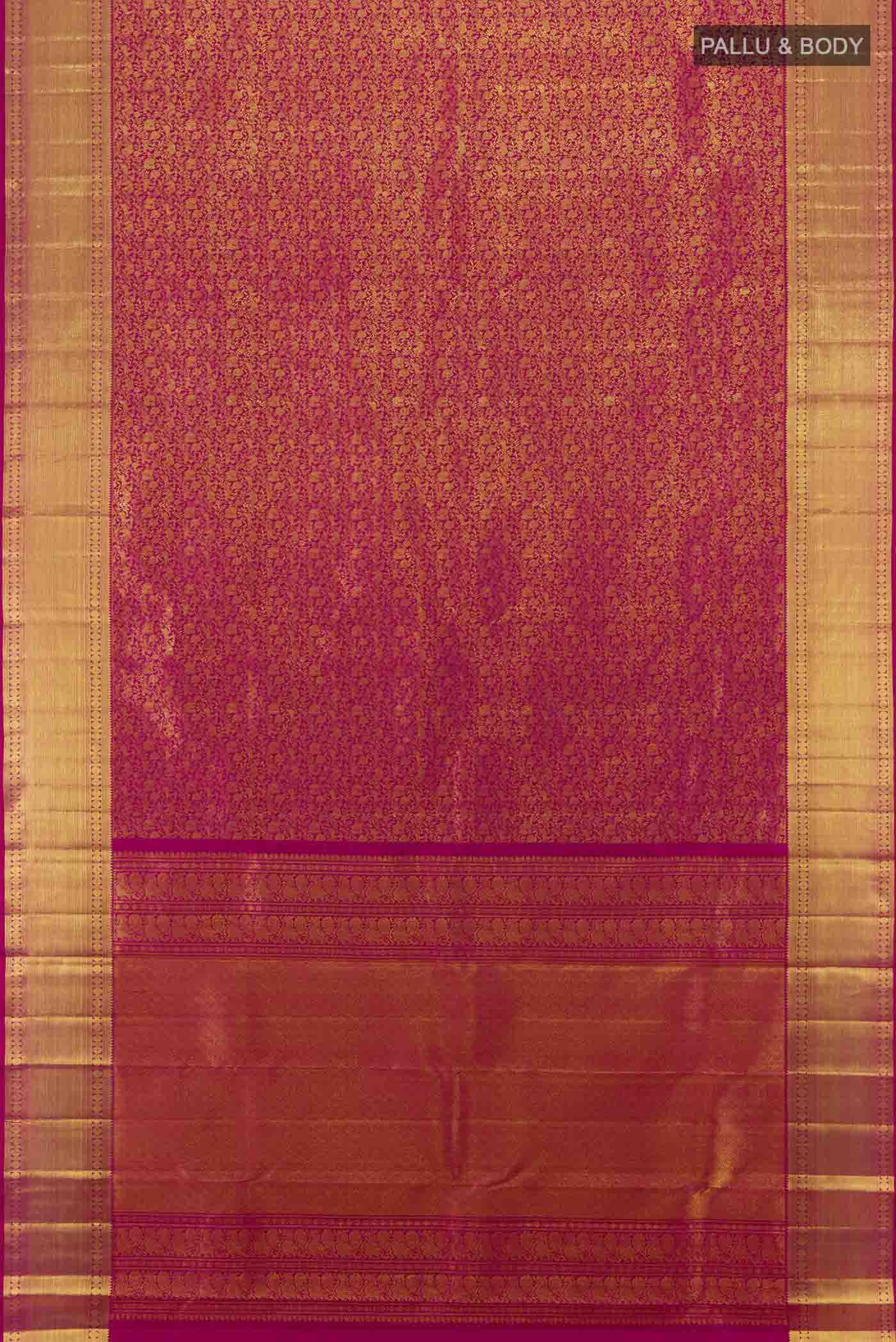 Flat view of Magenta Kanchipuram Silk Saree with Zari Butta on the body and Silk Border. 