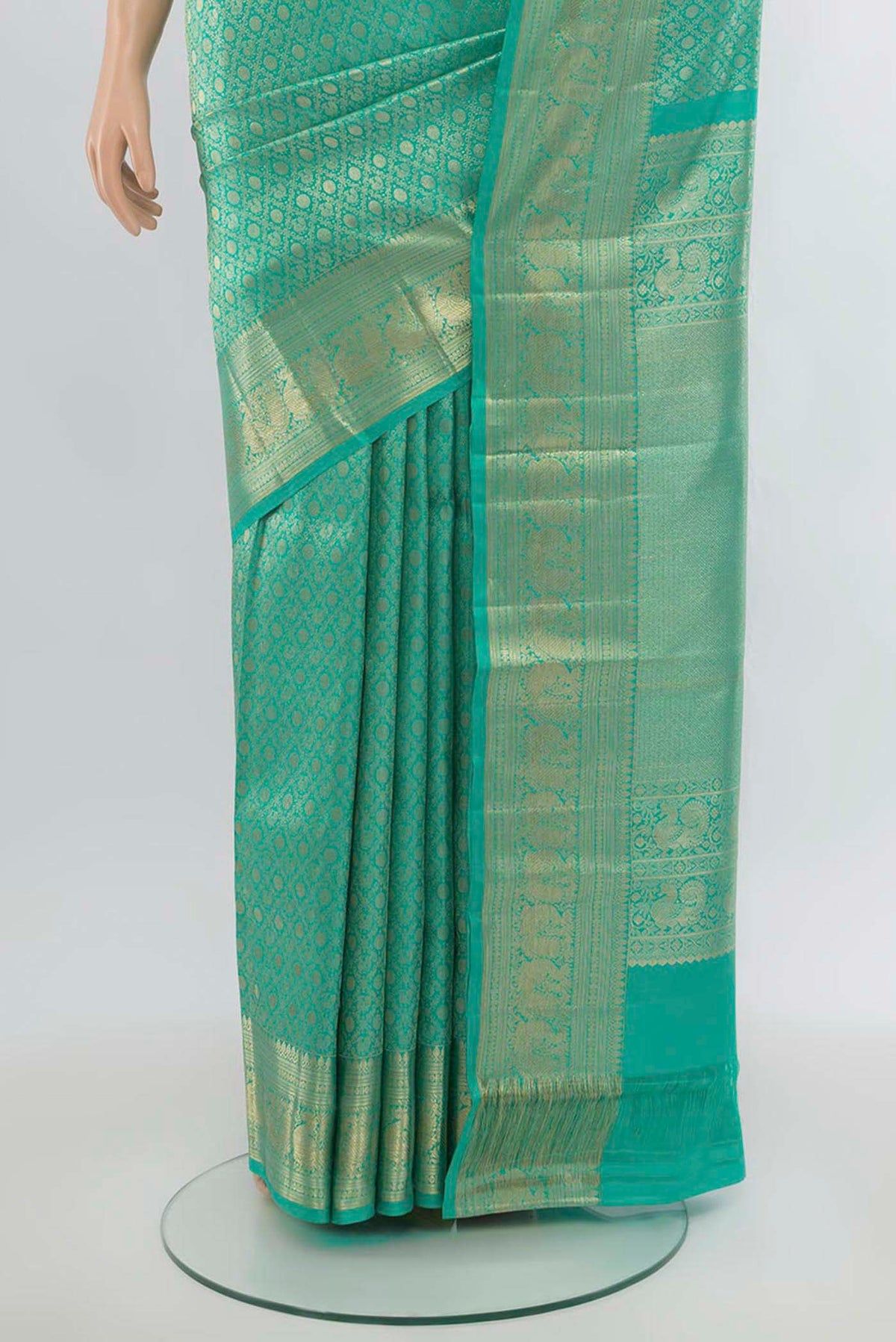 Pleats and pallu of Sea Green Kanchipuram Silk Saree with Zari Butta on the body and Silk Border. 