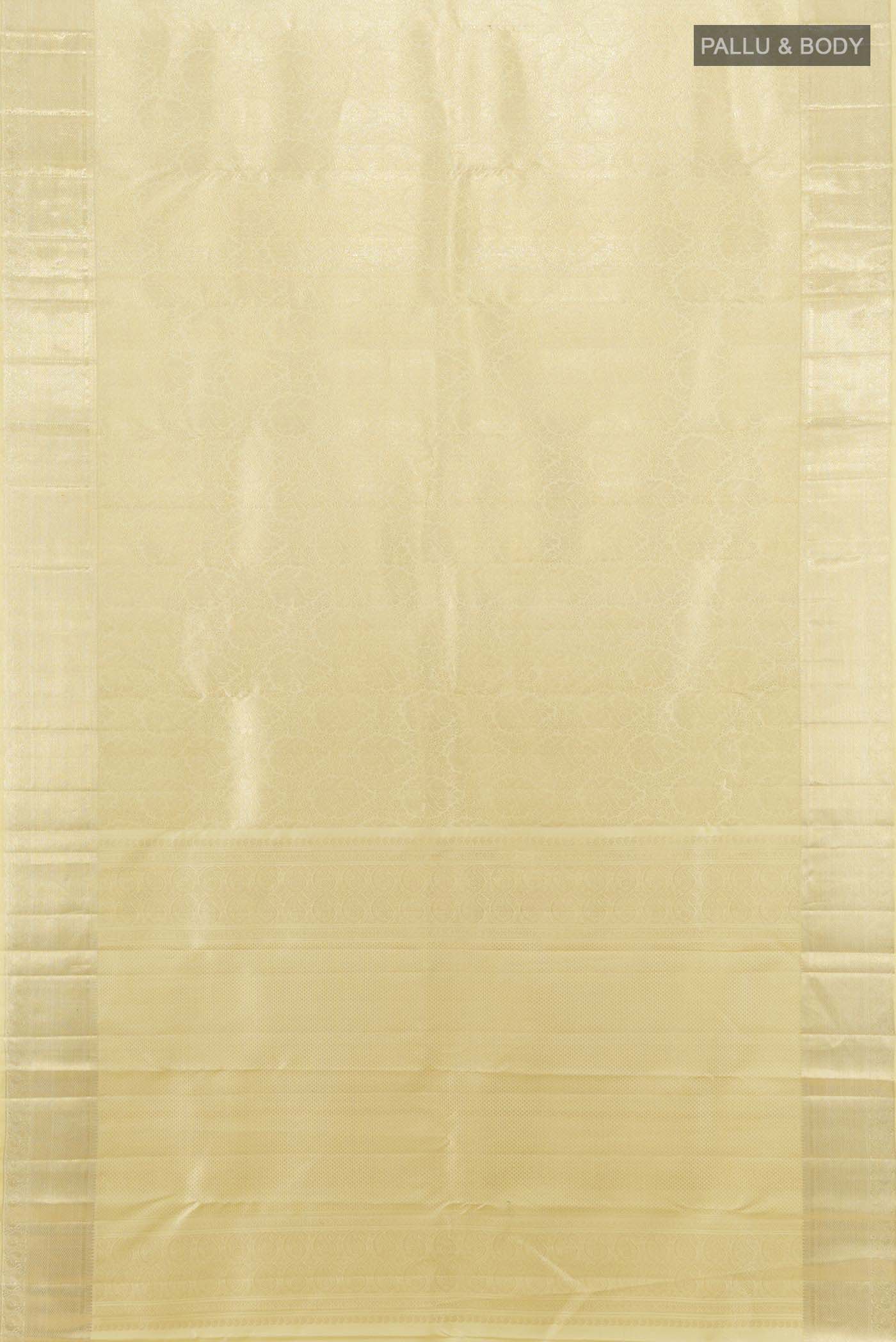 Flat view of Cream Kanchipuram Silk Saree with Zari Butta on the body and Silk Border. 