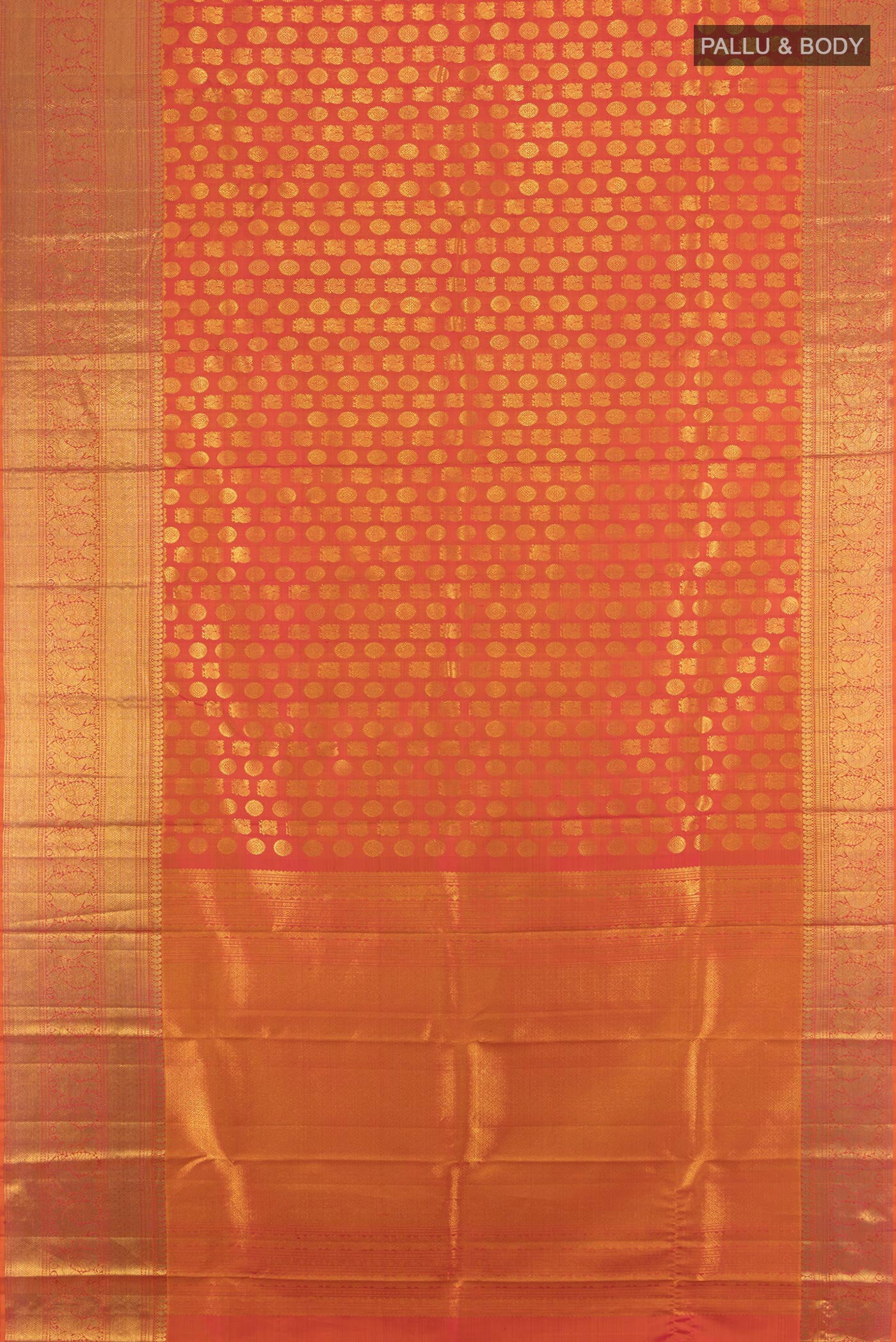 Flat view of Brick Orange Kanchipuram Silk Saree with Zari Butta on the body and Zari Border. 