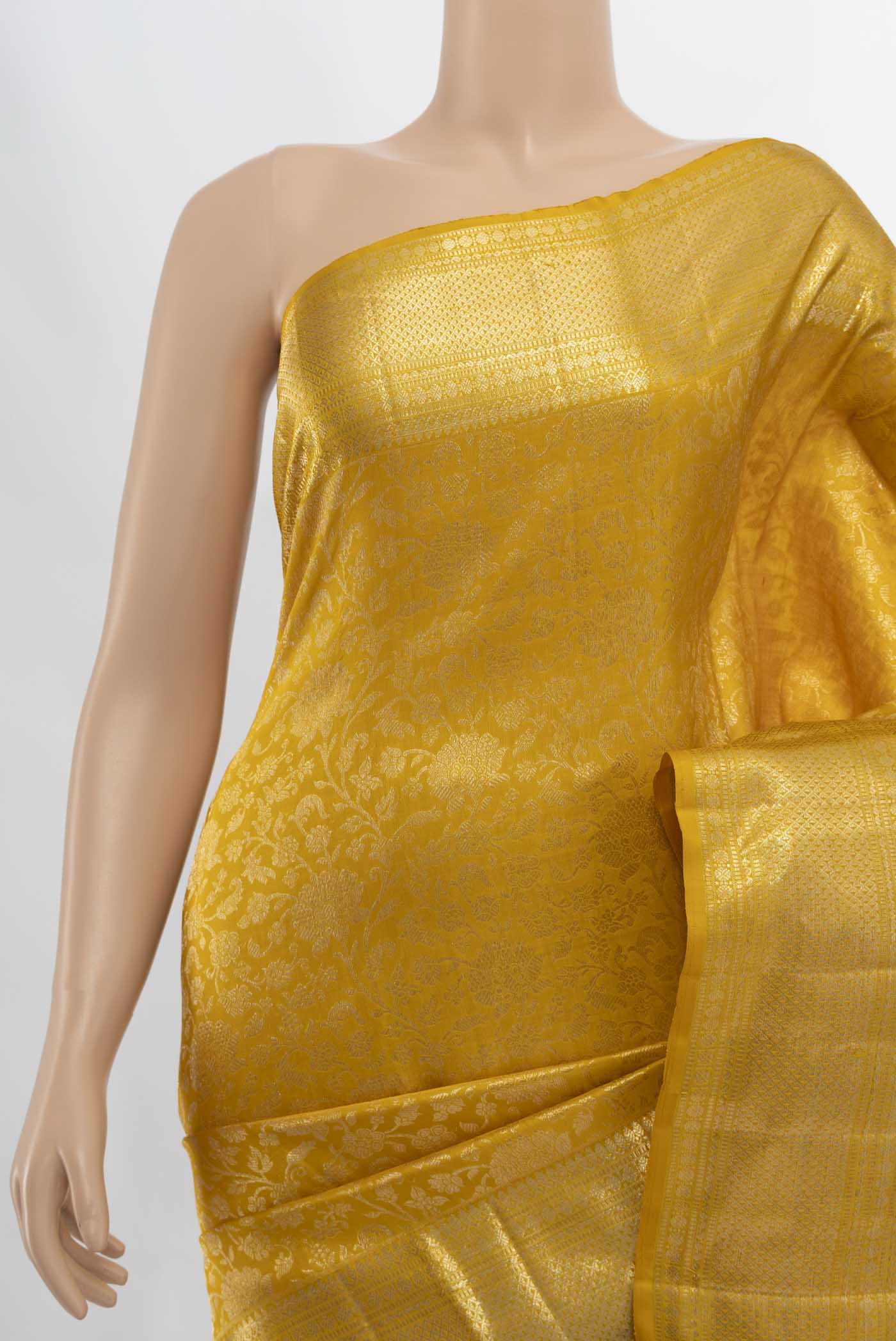 Border image of Yellow Kanchipuram Silk Saree with Zari Butta on the body and Silk Border. 