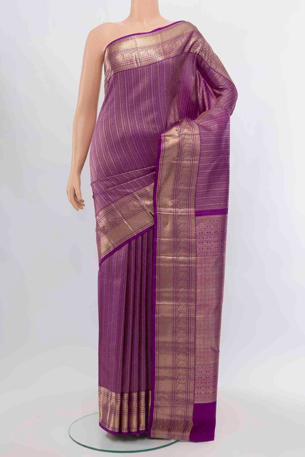 Violet Kanchipuram Silk Saree with Zari Butta on the body and Silk Border.  displayed on a mannequin