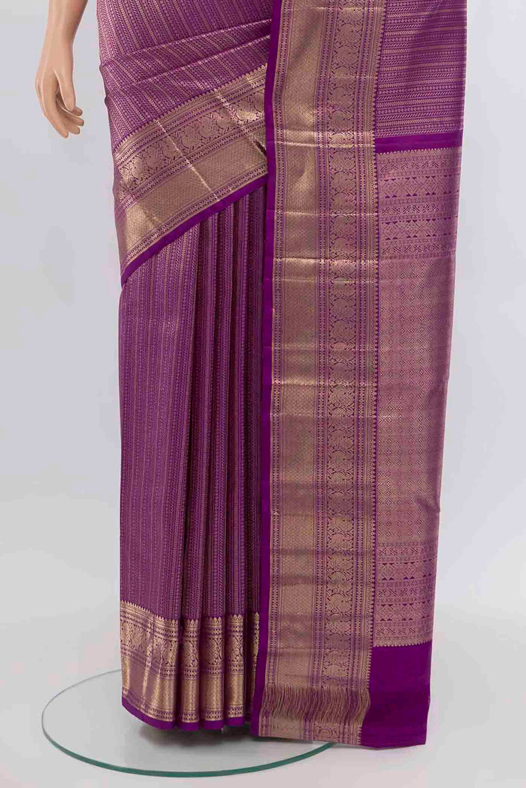 Pleats and pallu of Violet Kanchipuram Silk Saree with Zari Butta on the body and Silk Border. 
