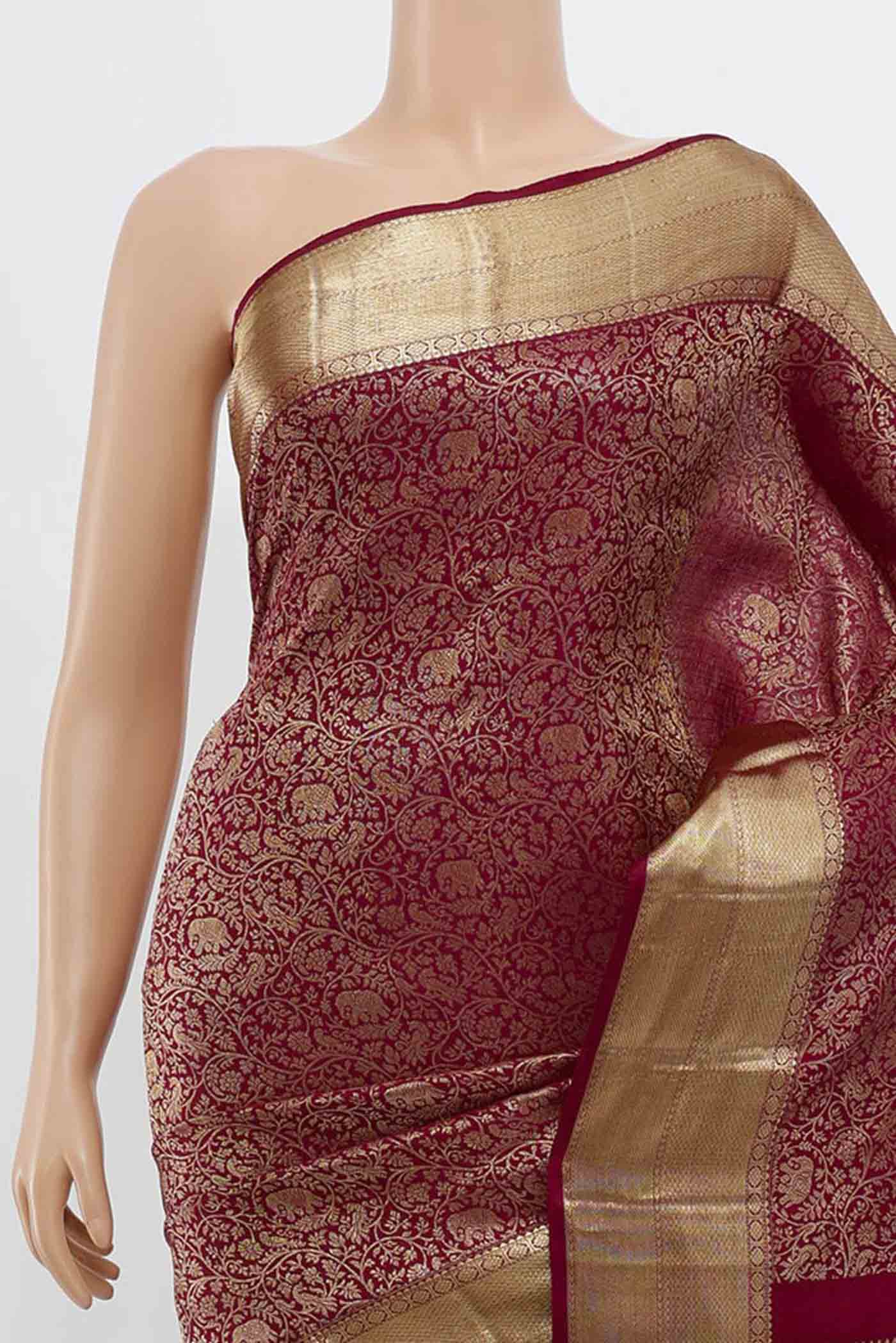 Border image of Maroon Kanchipuram Silk Saree with Zari Butta on the body and Silk Border. 
