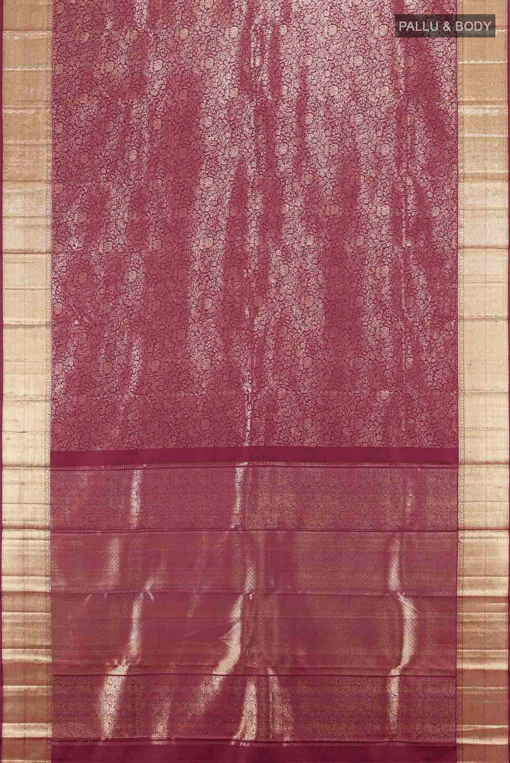 Flat view of Maroon Kanchipuram Silk Saree with Zari Butta on the body and Silk Border. 