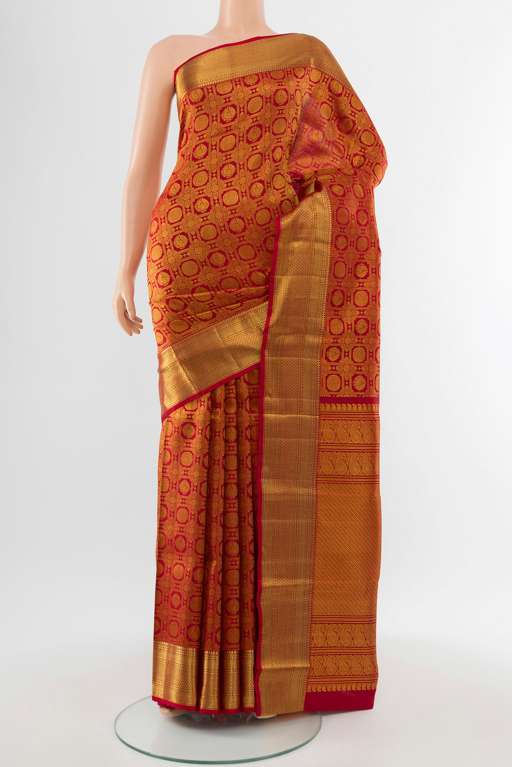 Pure Silk Pure Zari Maroon Kanchipuram Saree with Zari Butta on the body and Silk Border.  displayed on a mannequin