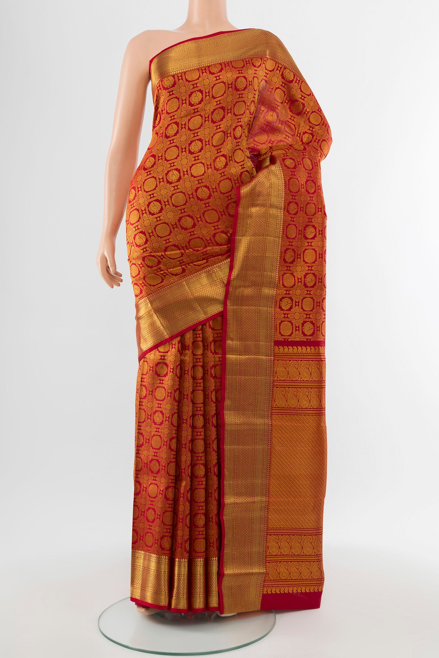 Pure Silk Pure Zari Maroon Kanchipuram Saree with Zari Butta on the body and Silk Border.  displayed on a mannequin
