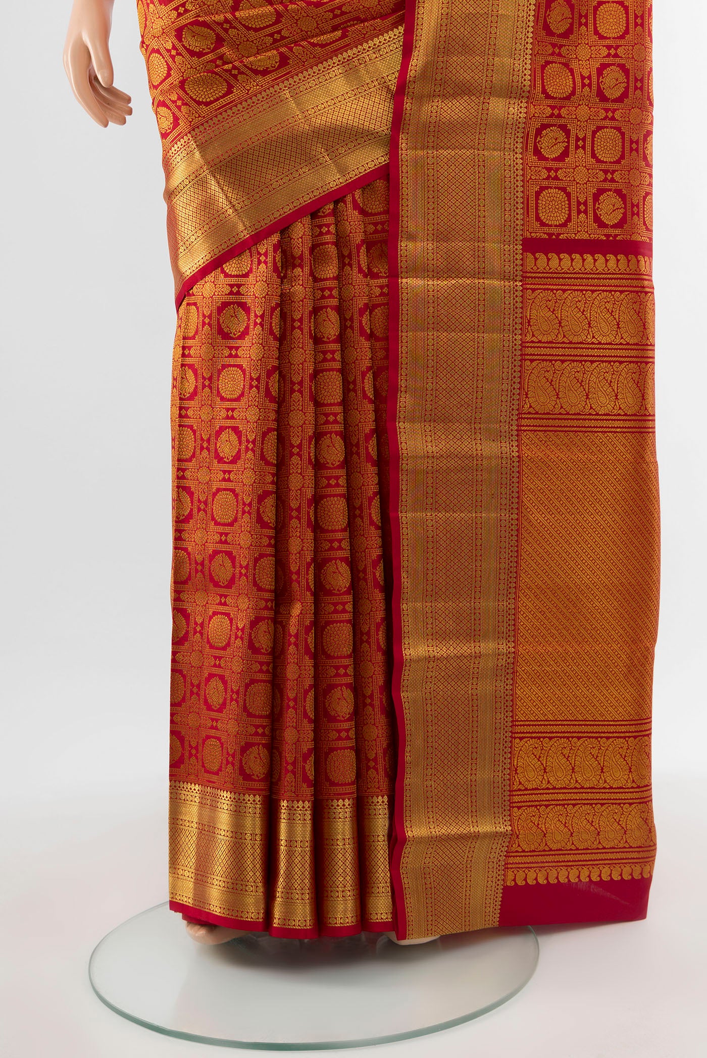 Pleats and pallu of Pure Silk Pure Zari Maroon Kanchipuram Saree with Zari Butta on the body and Silk Border. 