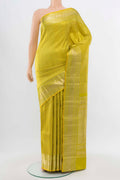 Pista Green Kanchipuram Silk Saree with Zari Butta on the body and Silk Border displayed on a mannequin