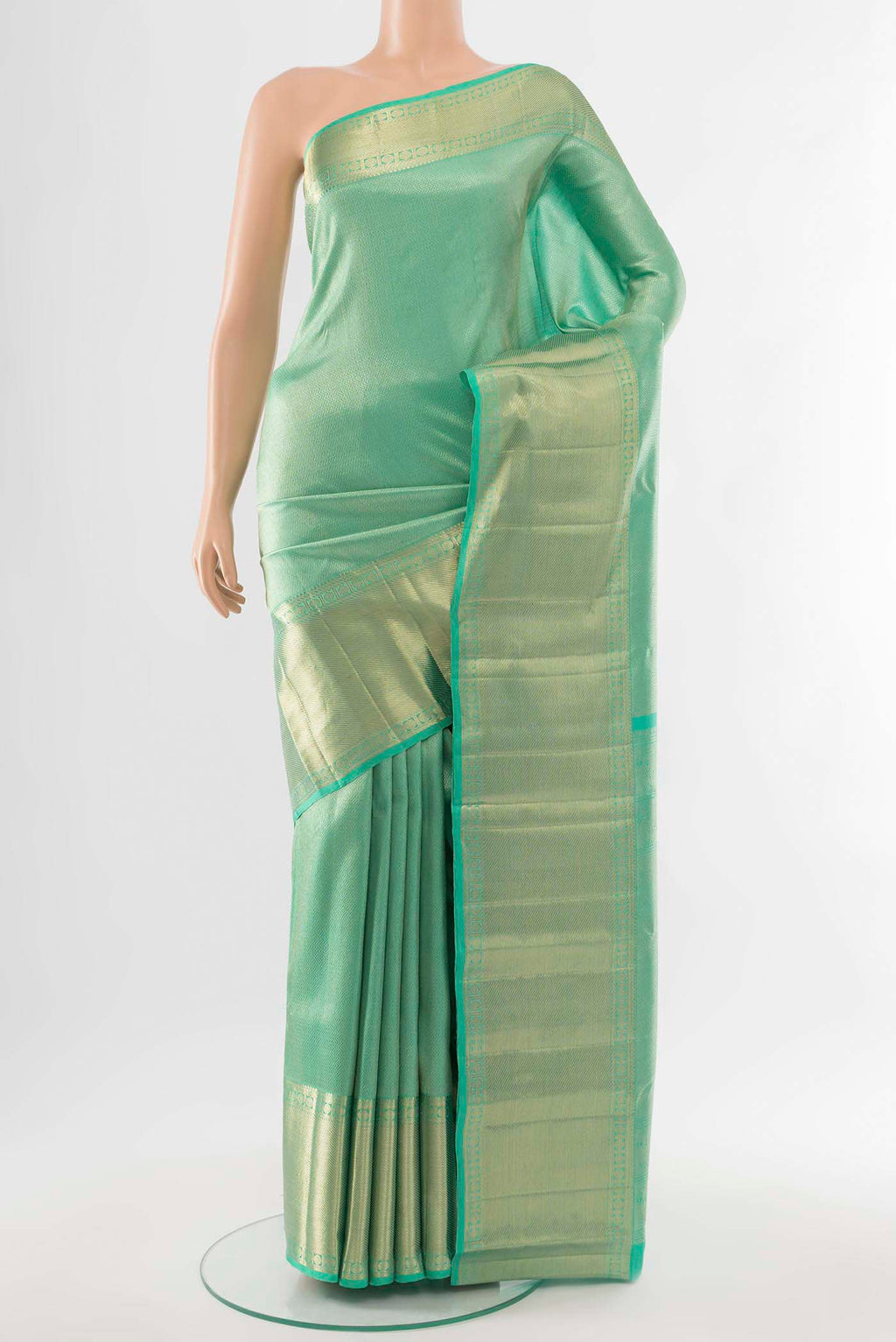 Sea Green Kanchipuram Silk Saree with Zari Butta on the body and Silk Border.  displayed on a mannequin