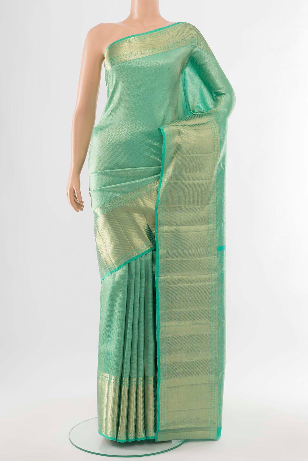 Sea Green Kanchipuram Silk Saree with Zari Butta on the body and Silk Border.  displayed on a mannequin