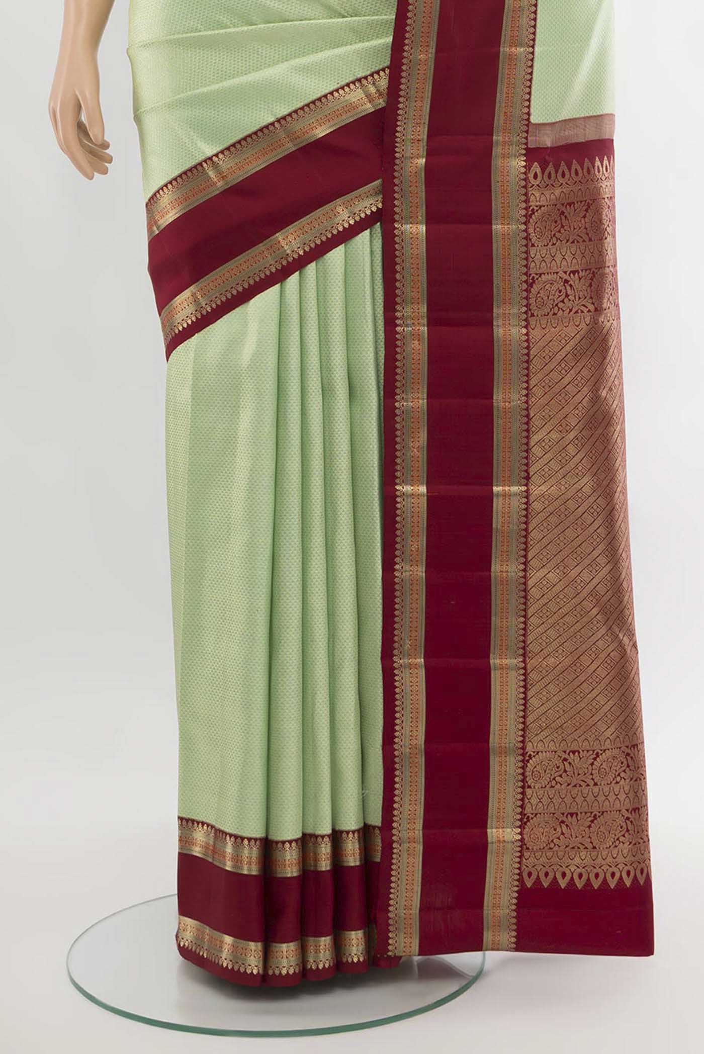 Pleats and pallu of Pista Green Kanchipuram Silk Saree with Zari Butta on the body and Silk Border. 