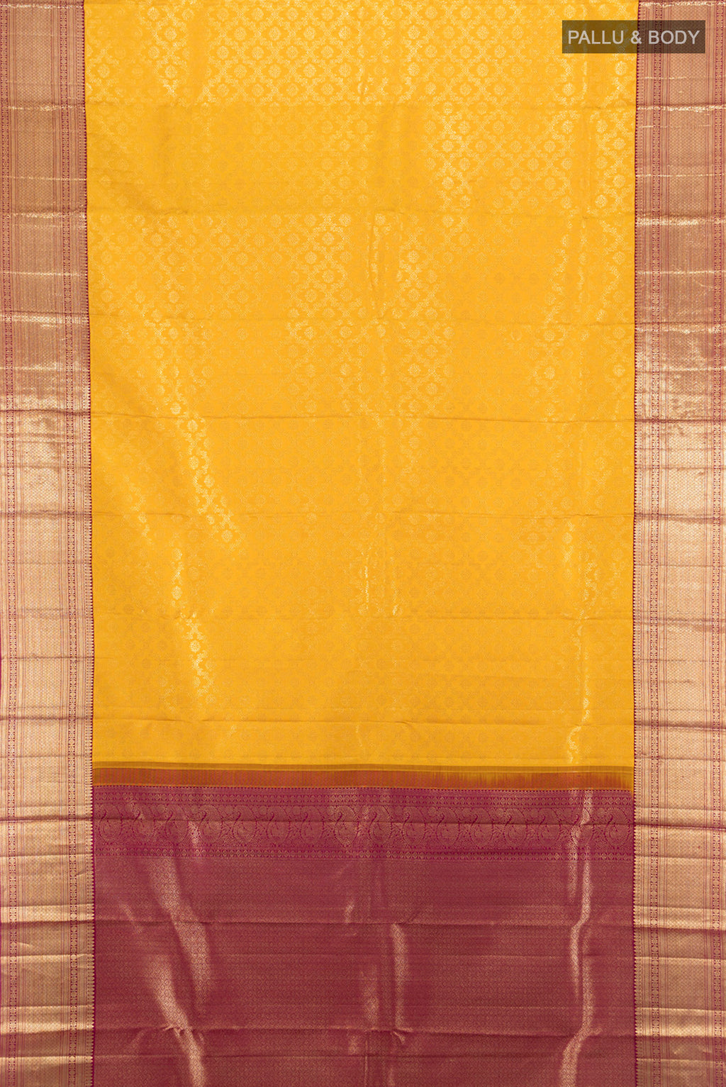 Flat view of Pure Silk Pure Zari Mustard Kanchipuram Saree with Zari Butta on the body and Silk Border. 