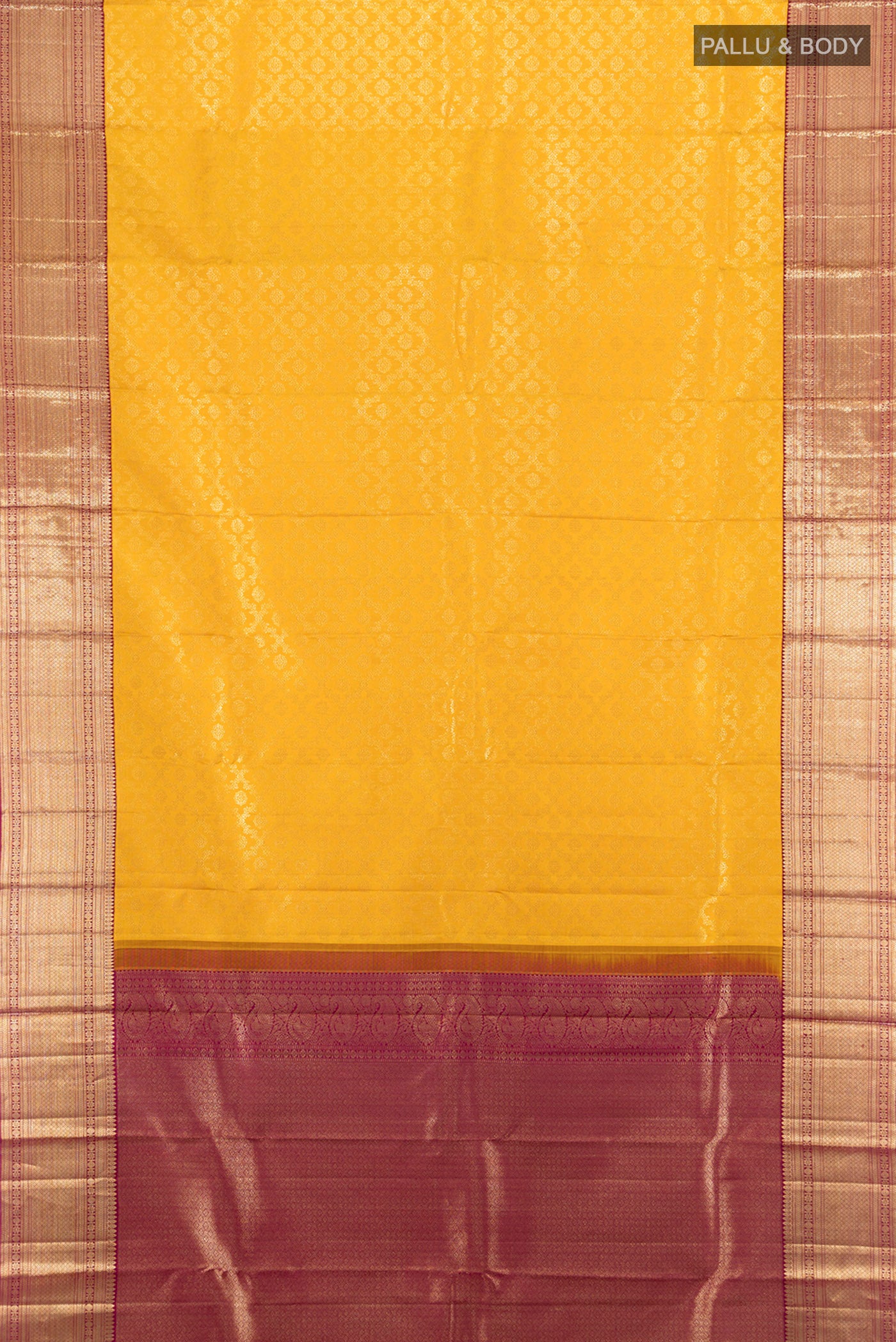 Flat view of Pure Silk Pure Zari Mustard Kanchipuram Saree with Zari Butta on the body and Silk Border. 