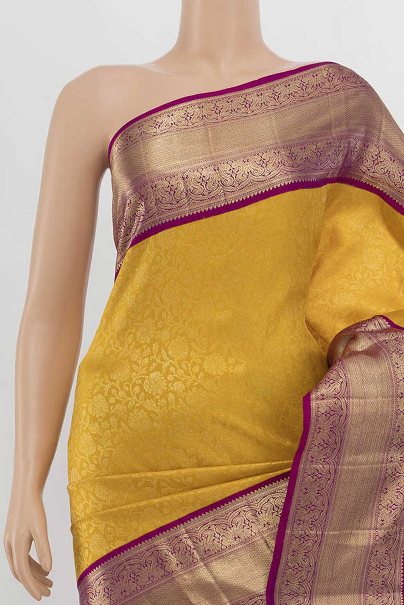 Border image of Yellow Kanchipuram Silk Saree with Zari Butta on the body and Silk Border. 