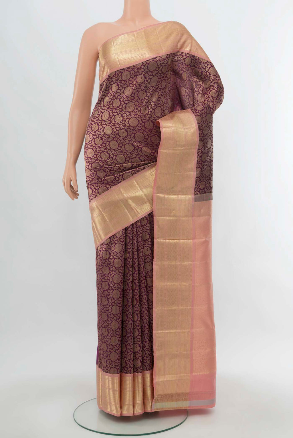 Purple Kanchipuram Silk Saree with Zari Butta on the body and Silk Border.  displayed on a mannequin