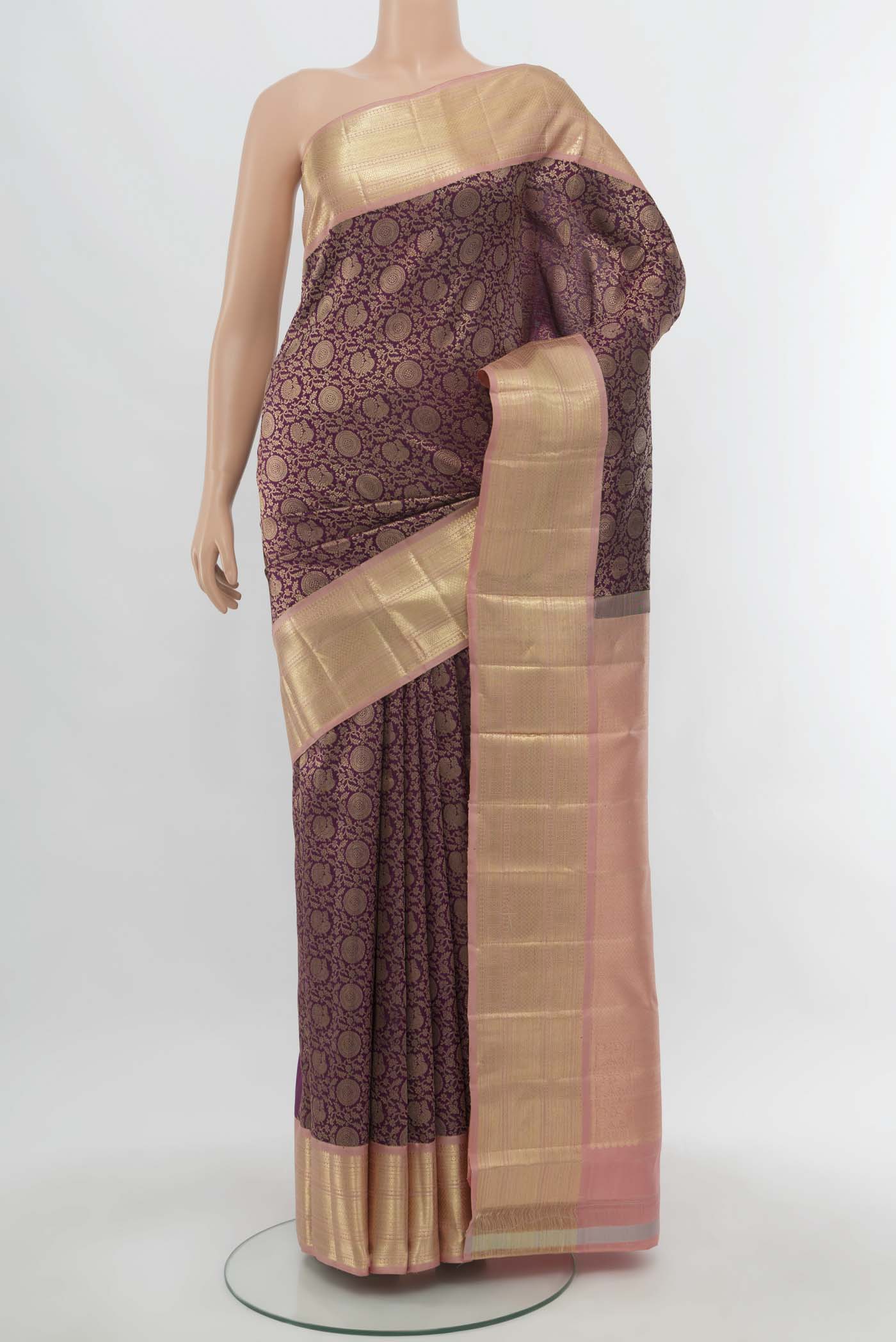 Purple Kanchipuram Silk Saree with Zari Butta on the body and Silk Border.  displayed on a mannequin