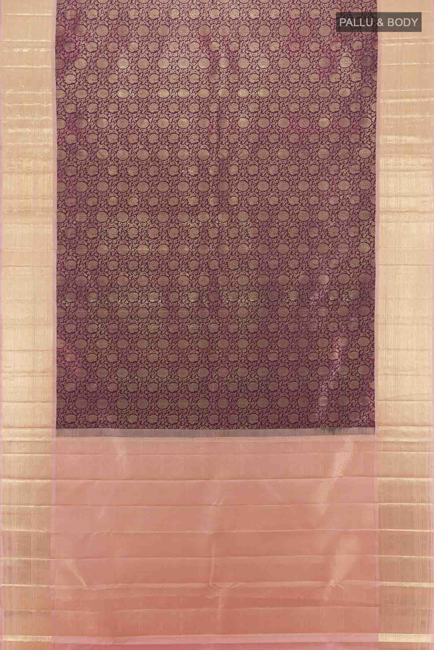 Flat view of Purple Kanchipuram Silk Saree with Zari Butta on the body and Silk Border. 