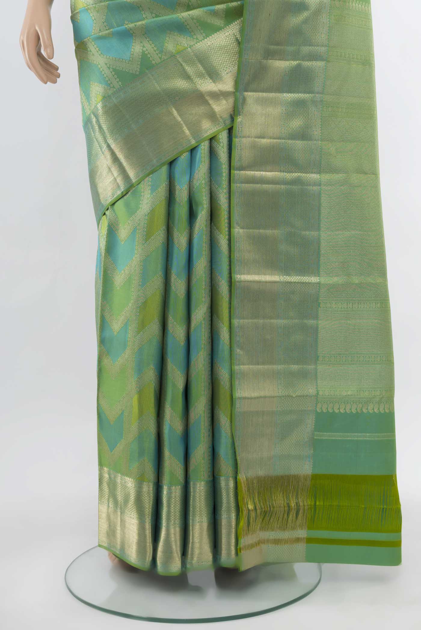 Pleats and pallu of Light Green Kanjivaram Silk Saree with Zari Butta on the body and Silk Border. 