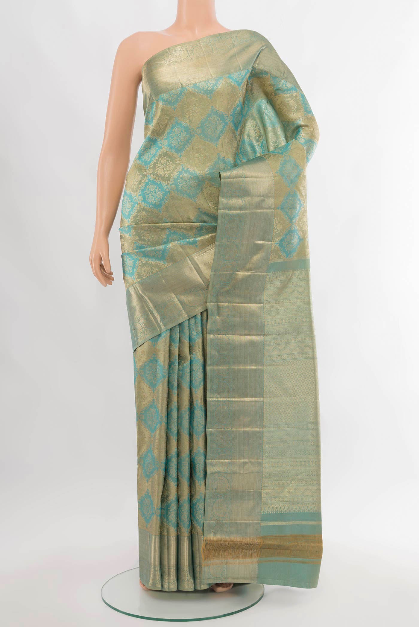 Sky Blue Kanjivaram Silk Saree with Zari Butta on the body and Silk Border.  displayed on a mannequin