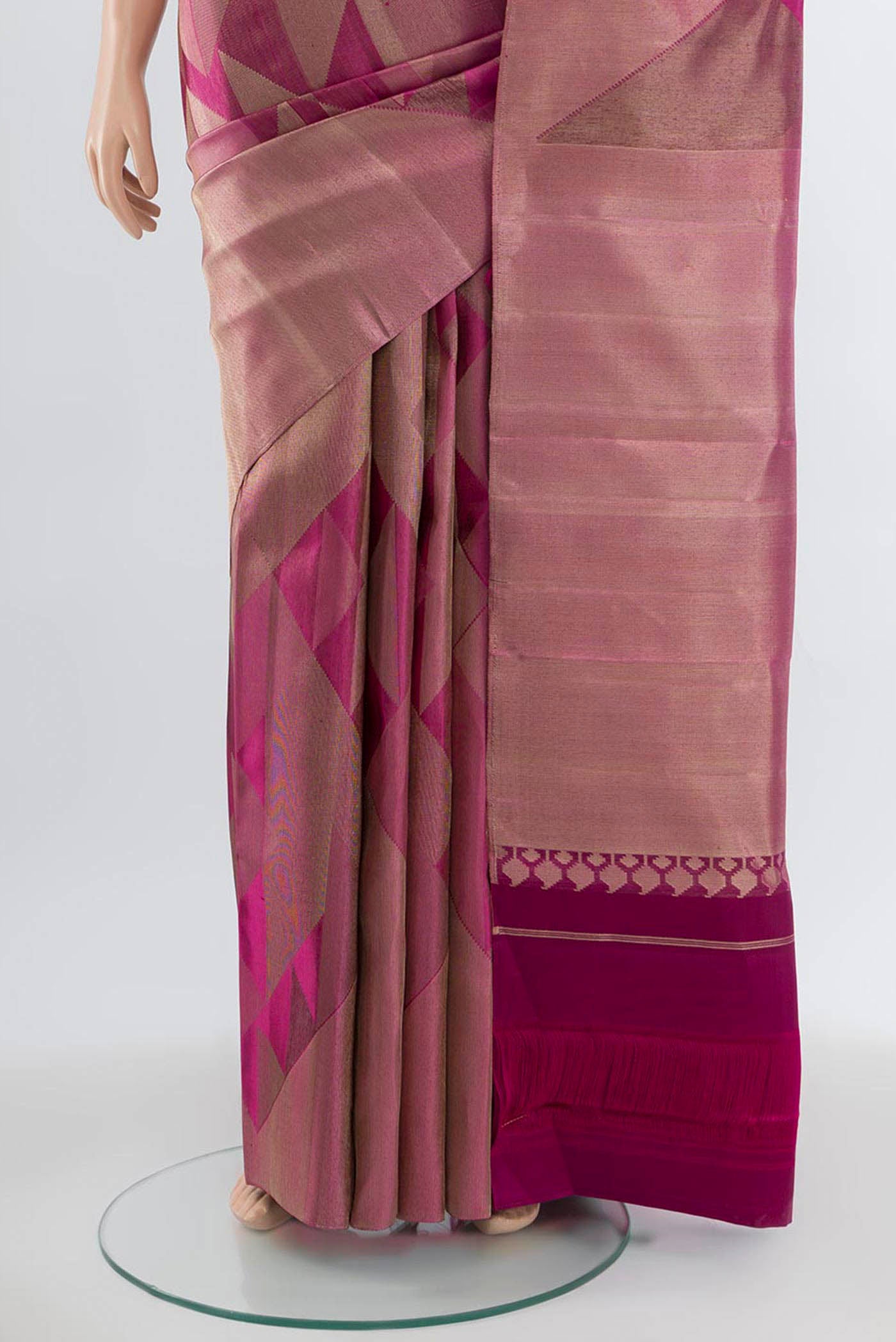 Pleats and pallu of Purple Kanjivaram Silk Saree with Zari Butta on the body and Silk Border. 