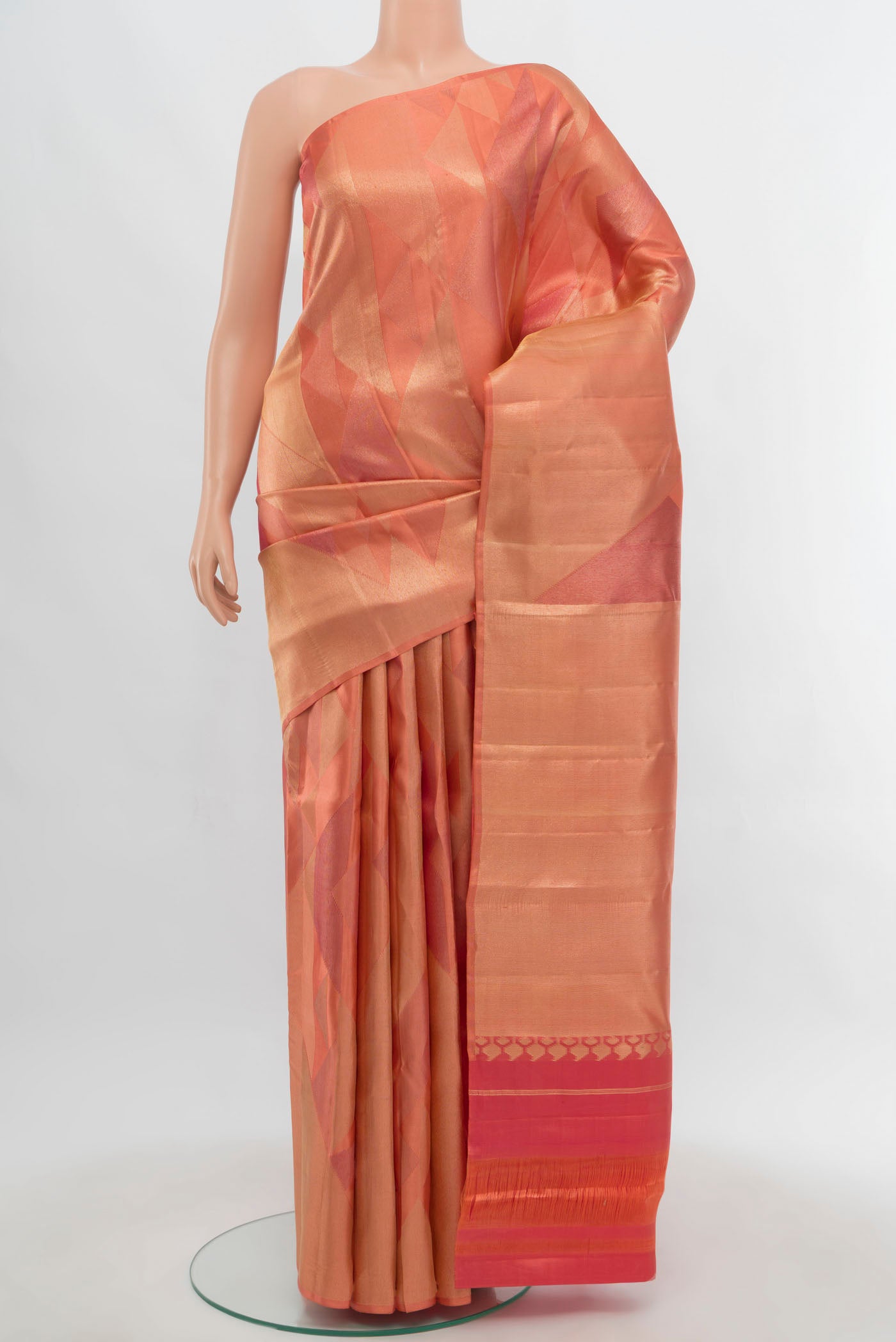 Golden Kanjivaram Silk Saree with Zari Butta on the body and Silk Border.  displayed on a mannequin