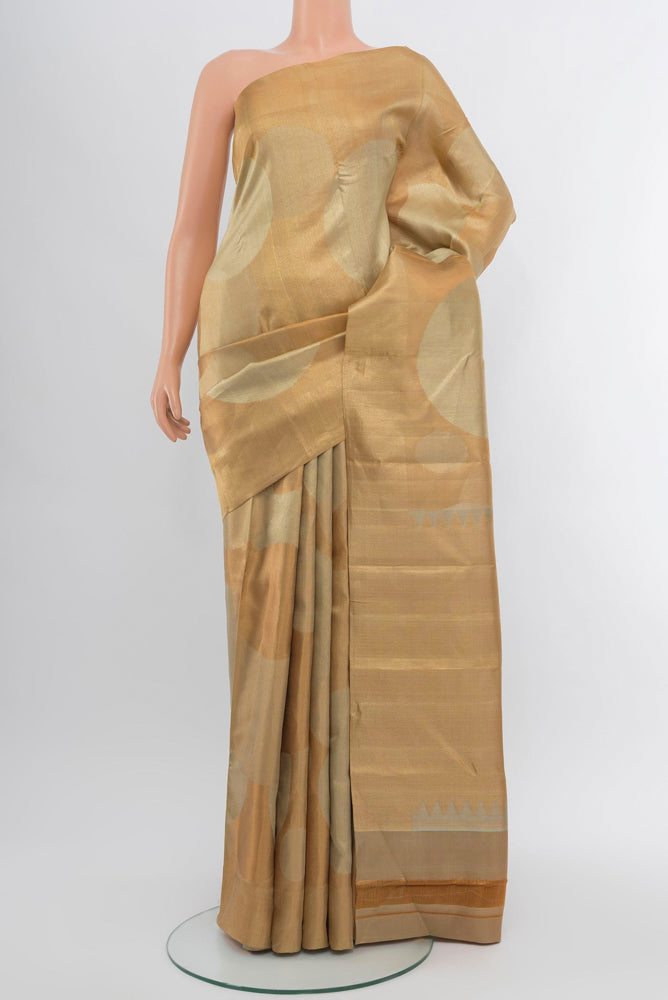 Golden Kanjivaram Silk Saree with Zari Brocade on the body and Zari Border.  displayed on a mannequin