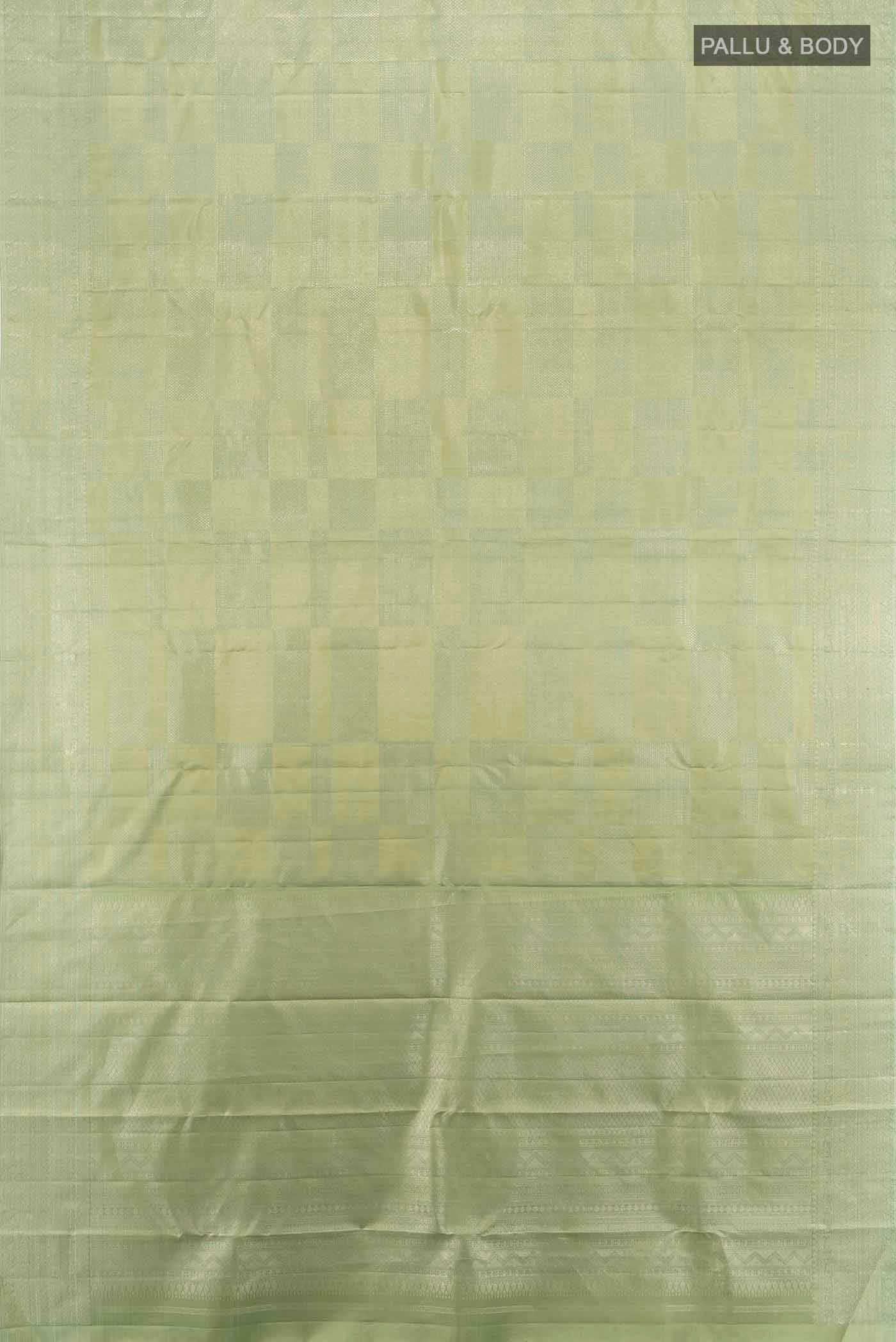 Flat view of Pista Green Kanjivaram Silk Saree with Zari Butta on the body and Silk Border. 