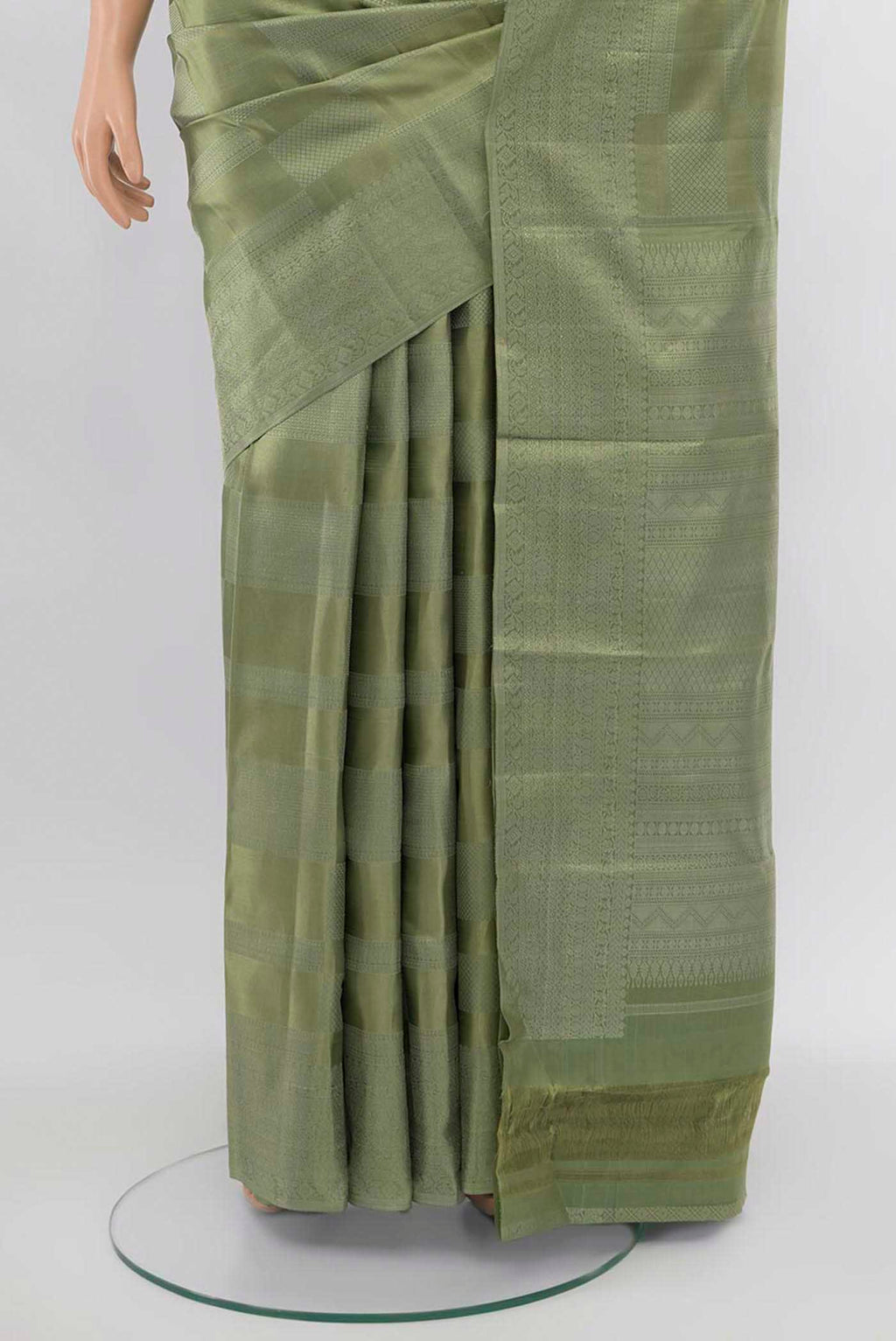 Pleats and pallu of Pista Green Kanjivaram Silk Saree with Zari Butta on the body and Silk Border. 