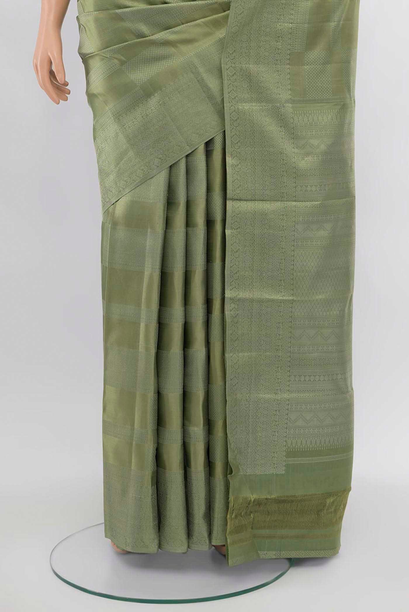 Pleats and pallu of Pista Green Kanjivaram Silk Saree with Zari Butta on the body and Silk Border. 