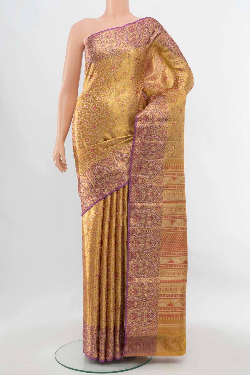 Pure Silk Pure Zari Golden Kanchipuram Saree with Zari Butta on the body and Silk Border.  displayed on a mannequin