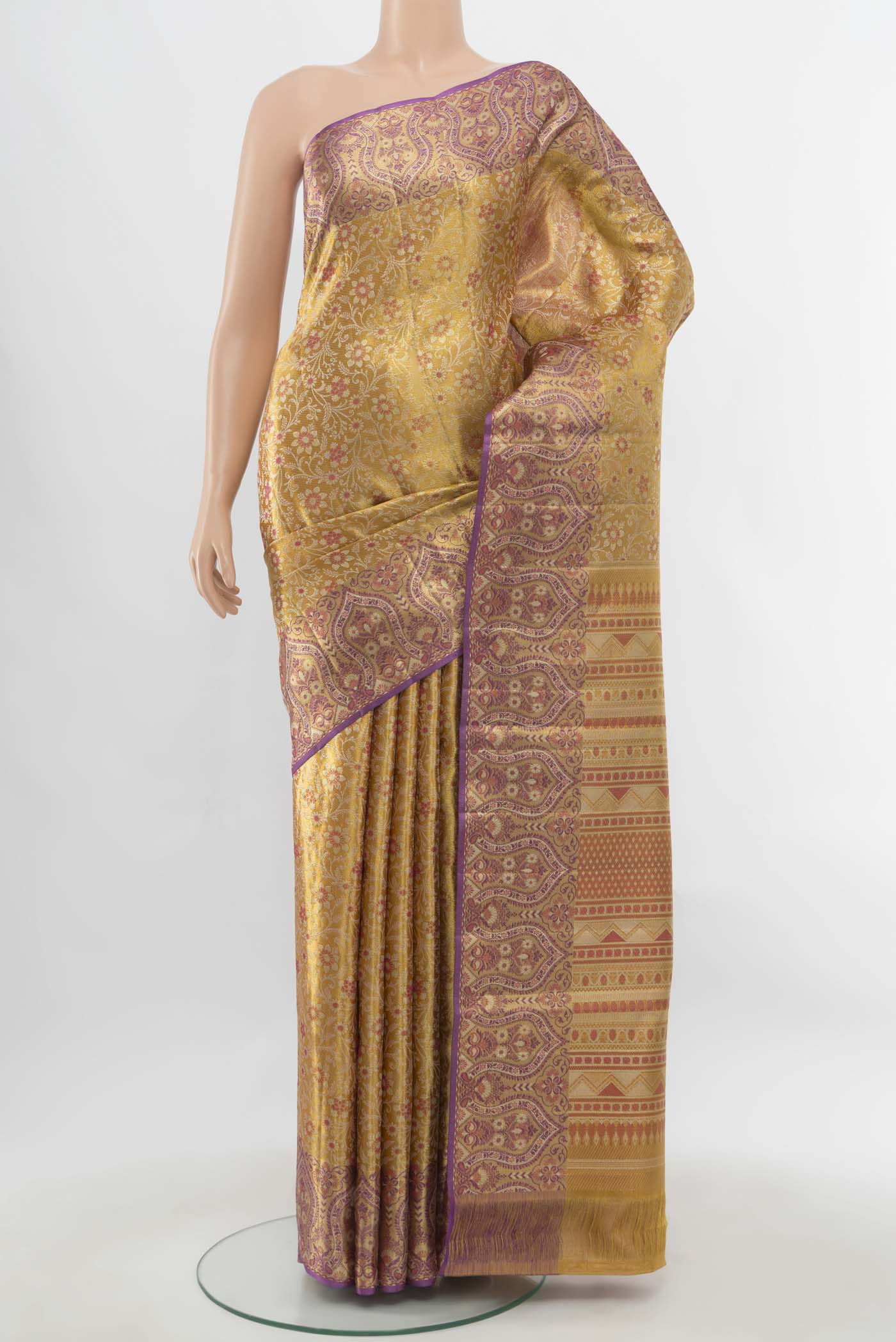 Pure Silk Pure Zari Golden Kanchipuram Saree with Zari Butta on the body and Silk Border.  displayed on a mannequin